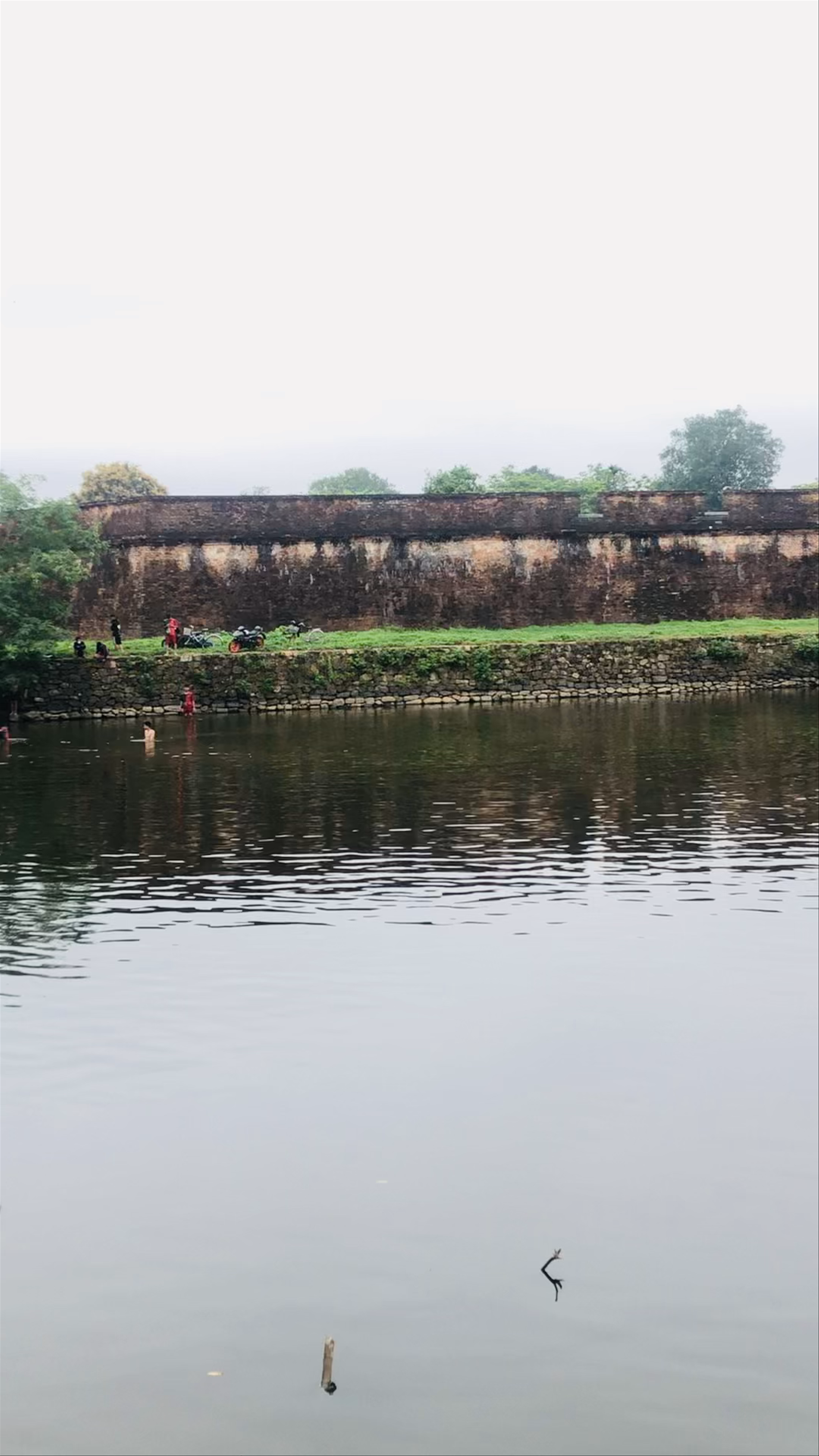 Historic Hue Citadel Gates with Reflective Moat - Tranquil Vietnamese Heritage Site