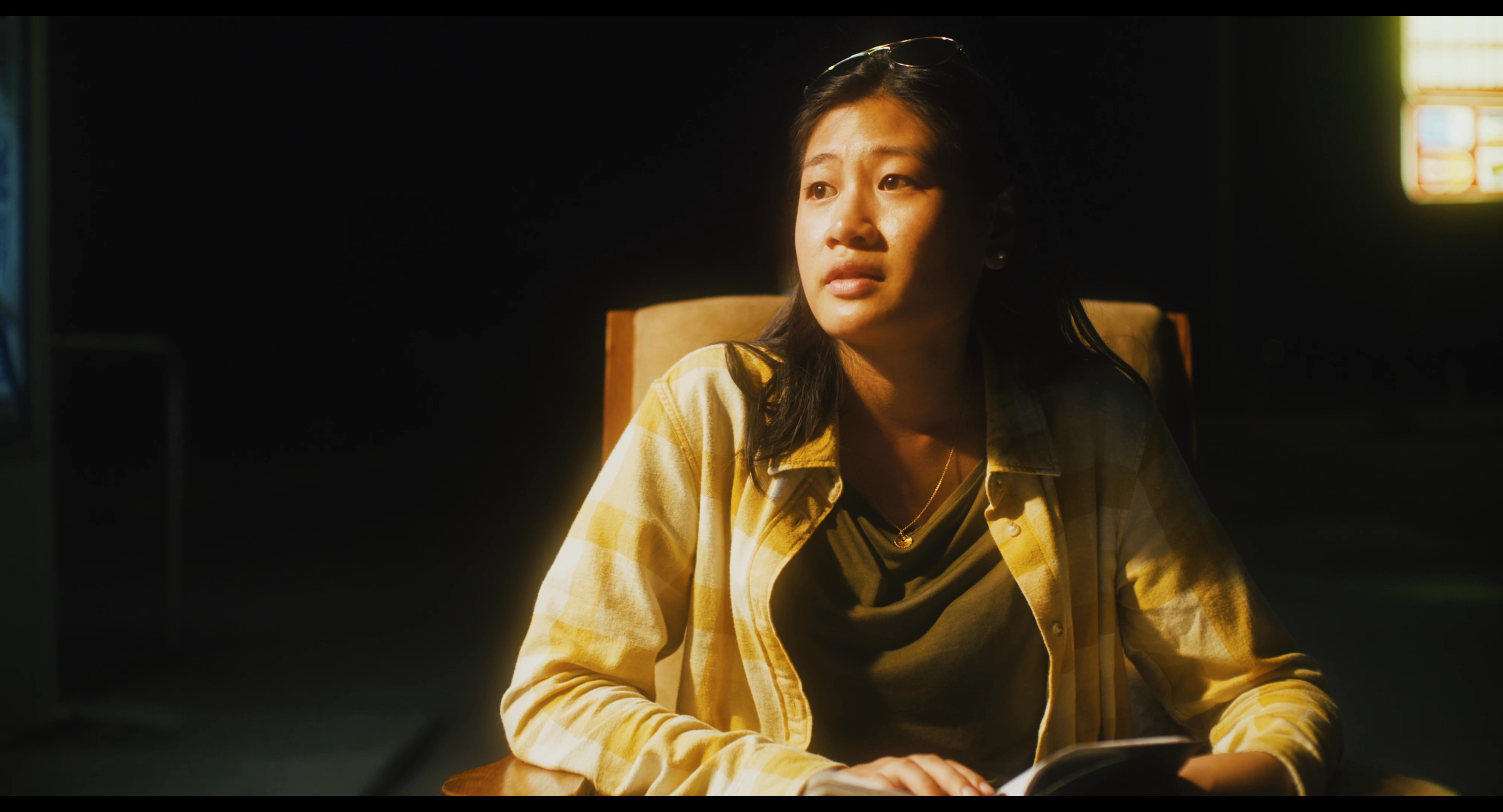 Two individuals engage in a structured conversation, alternating between perspectives within a dimly lit, cinematic environment.