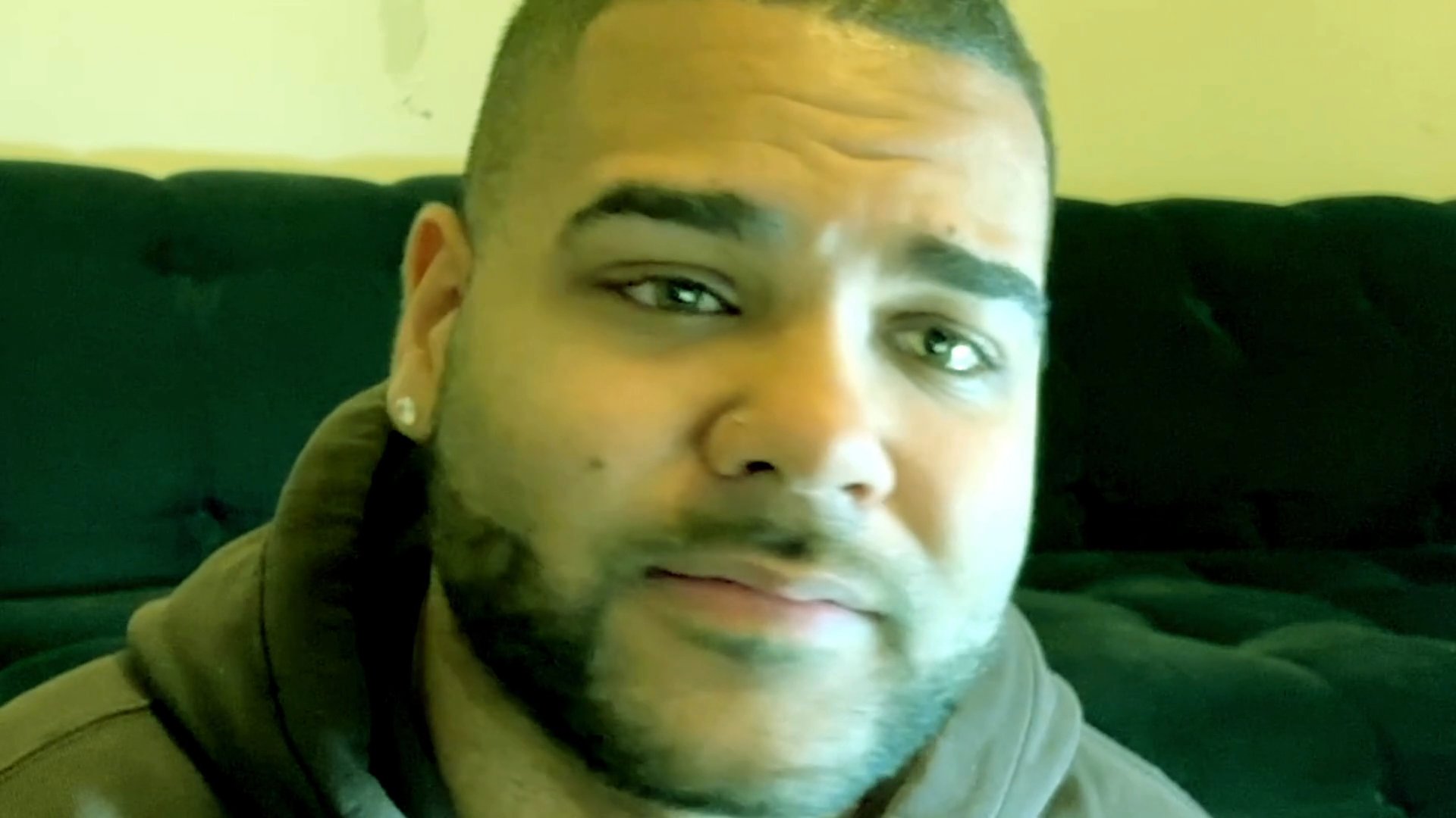 A man engages in a direct-to-camera discussion, expressing his thoughts and perspectives.