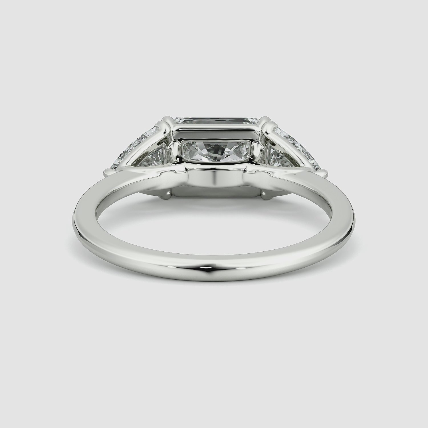 The Three Stone | Radiant | Platinum | bandAccent: Plain | diamondOrientation: horizontal | sideStoneCarat: 0.50ct | sideStoneShape: Trillion | caratWeight: other