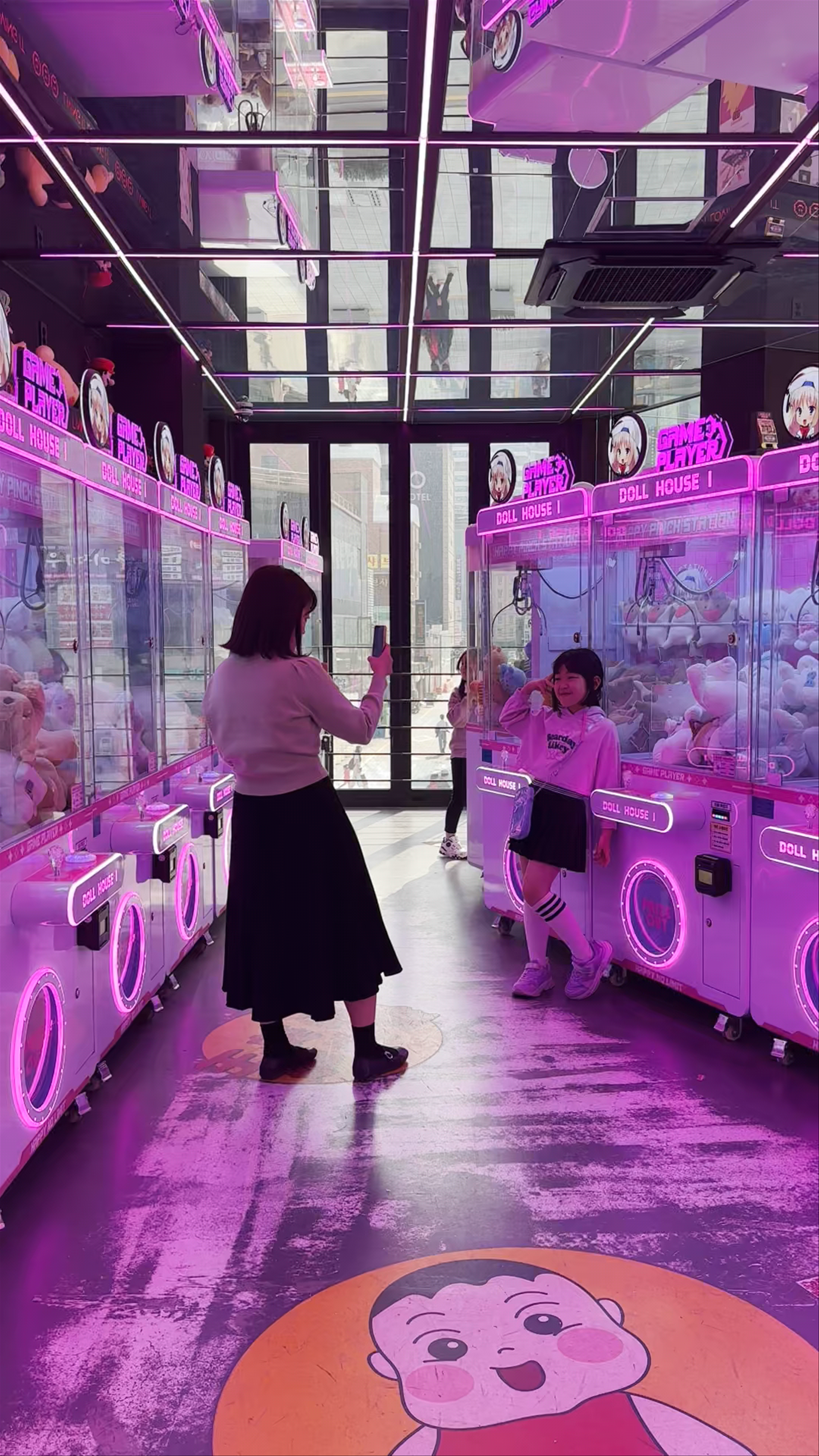 Neon Glow and Play: Claw Machines at GAME D in Busan
