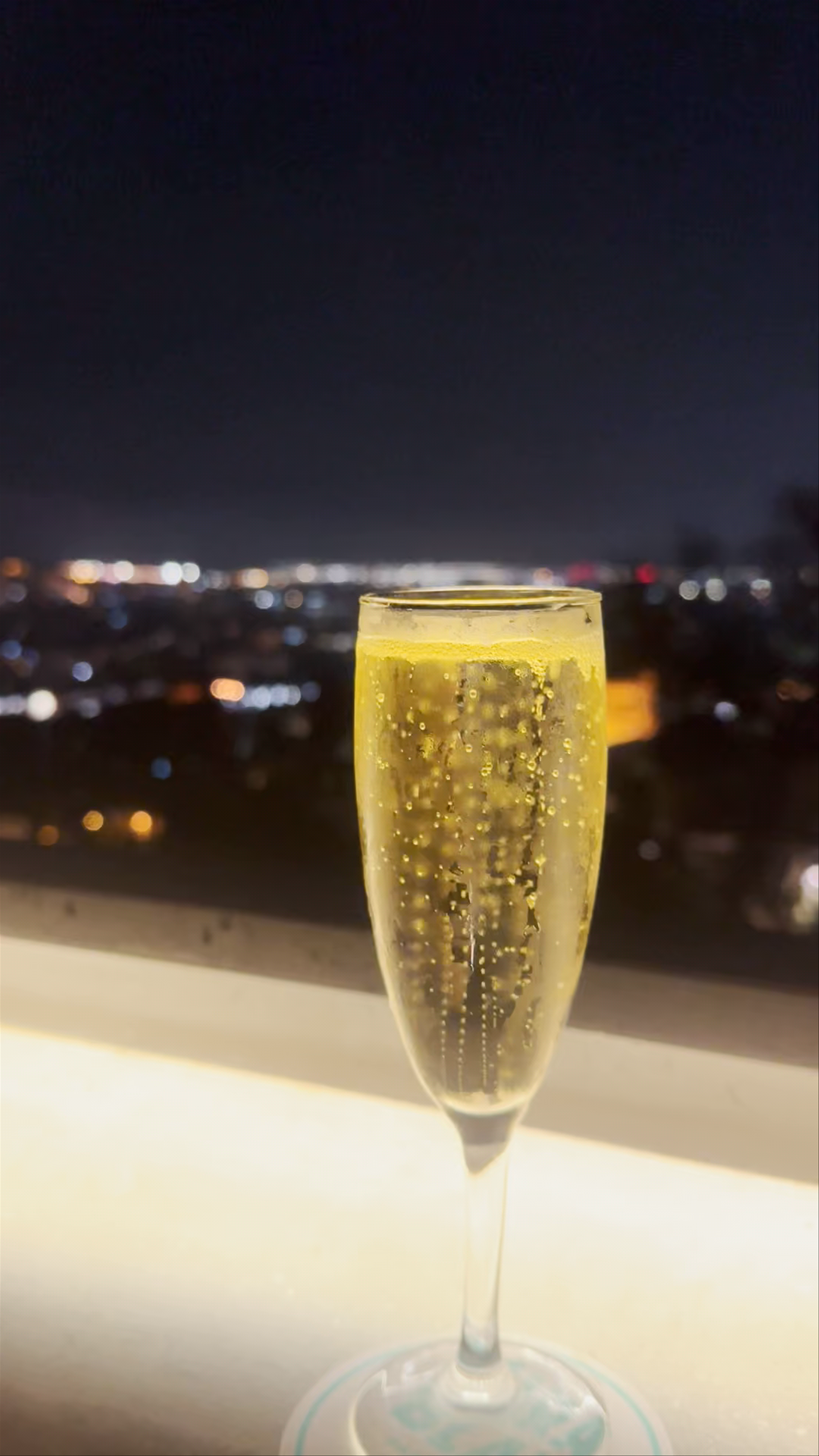 Nighttime Cityscape and Sparkling Champagne at El Balconet, Barcelona