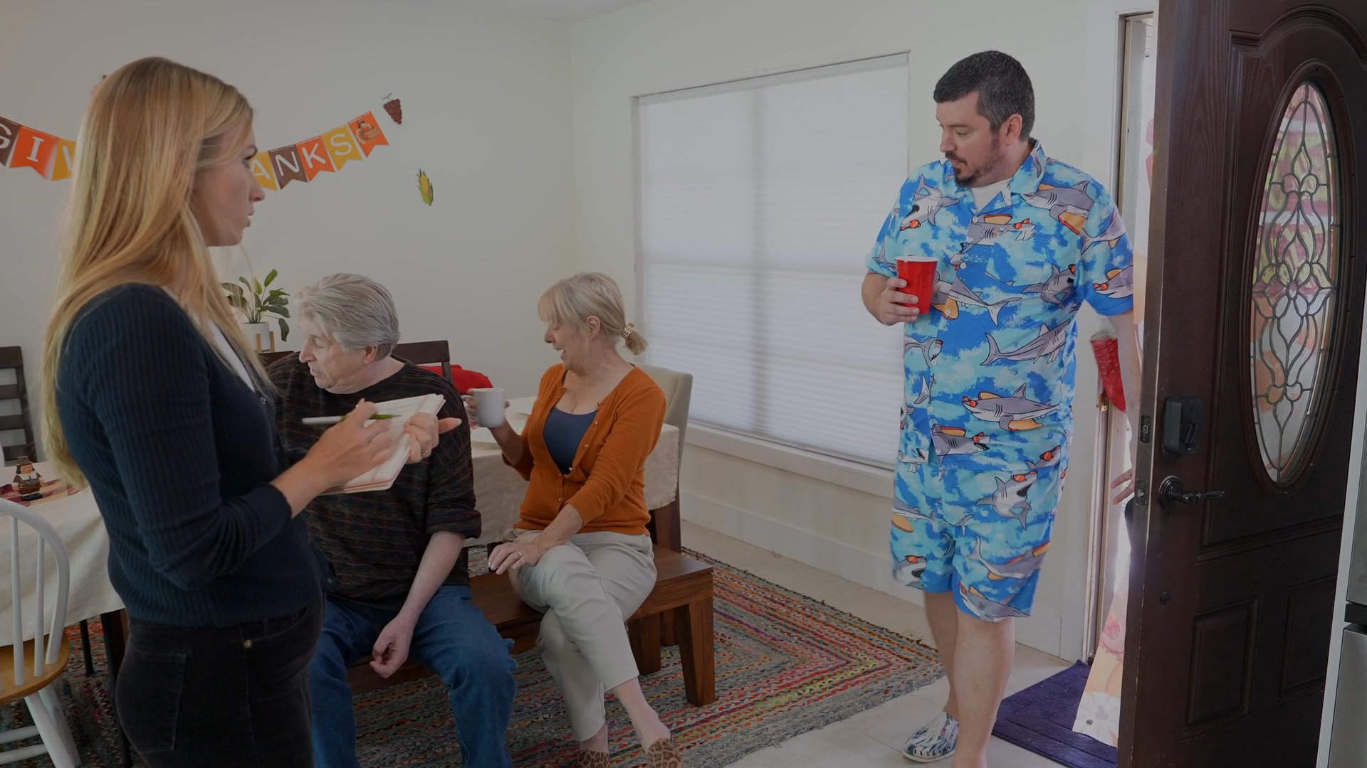 A man wakes up alone in bed before arriving at a family home, surprising his relatives during a holiday gathering.