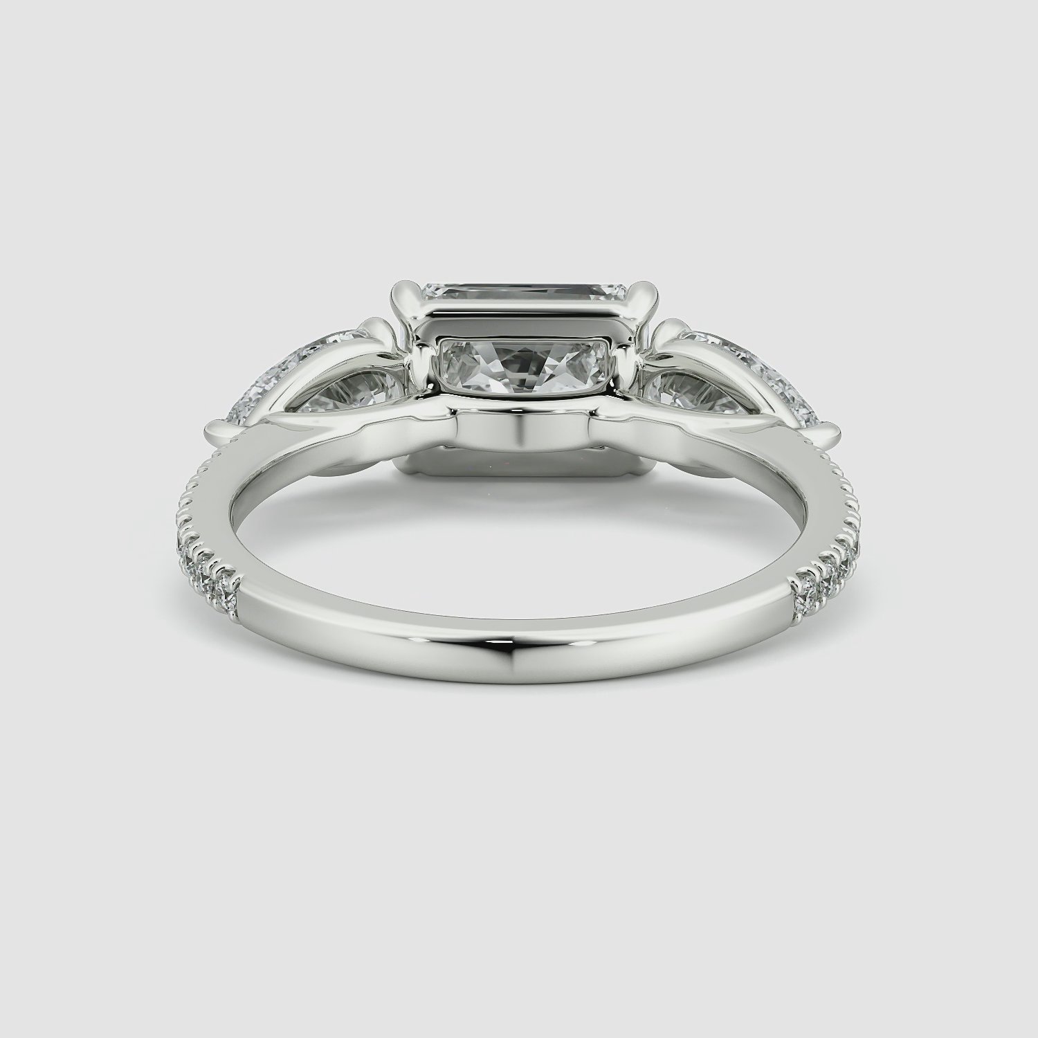 The Three Stone | Radiant | 18k | White Gold | bandAccent: Pavé | diamondOrientation: horizontal | sideStoneCarat: 0.50ct | sideStoneShape: Pear | caratWeight: other
