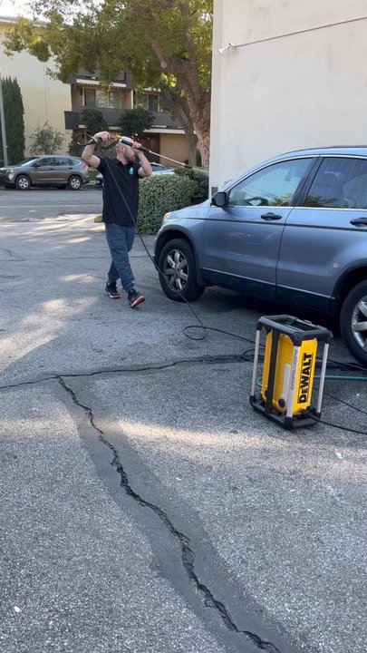 Shiny Solutions - Anton using the pressure washer - Window Washing Near Me