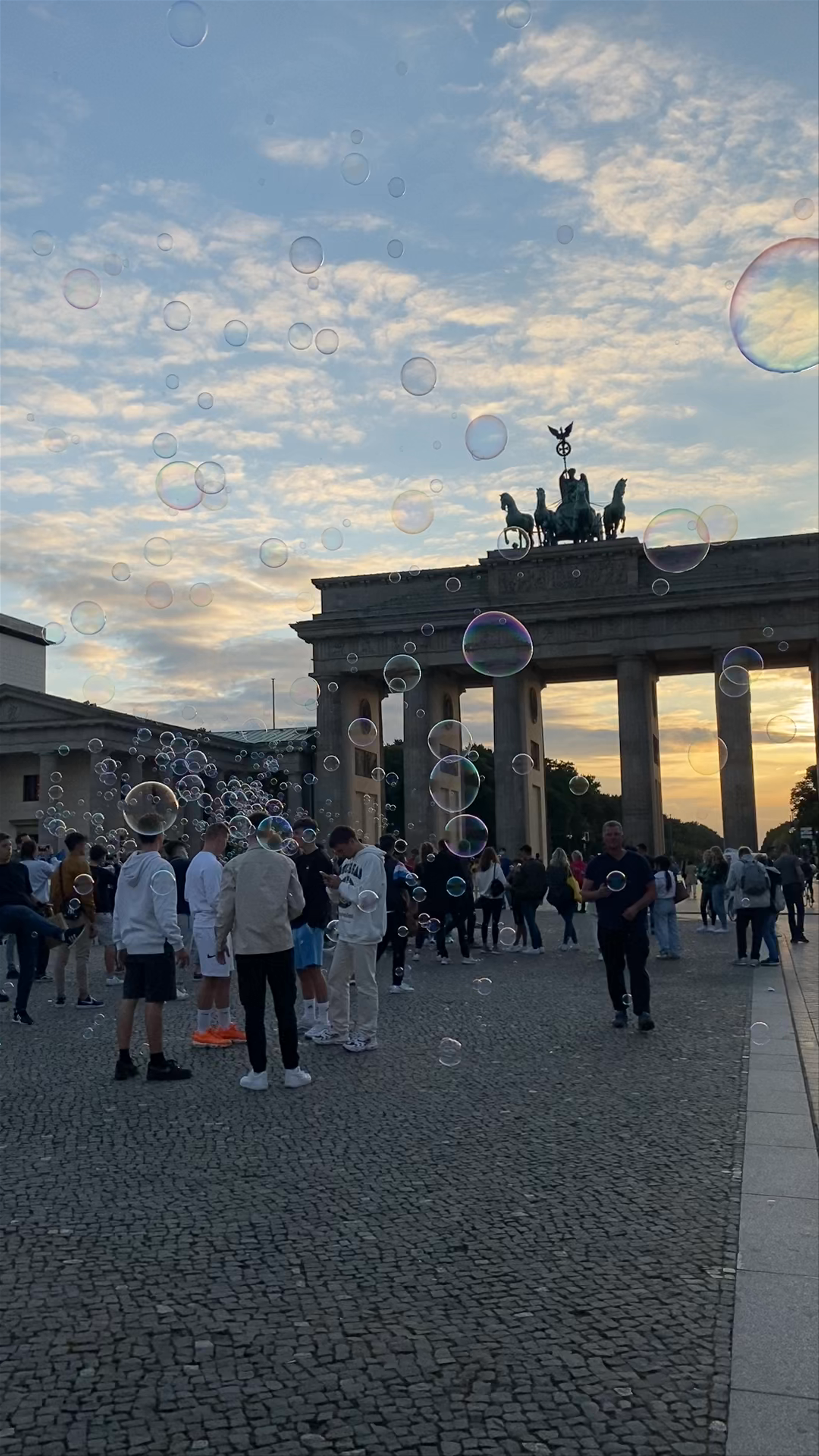 Brandenburg Gate: Sunset Magic and Playful Bubbles in Berlin