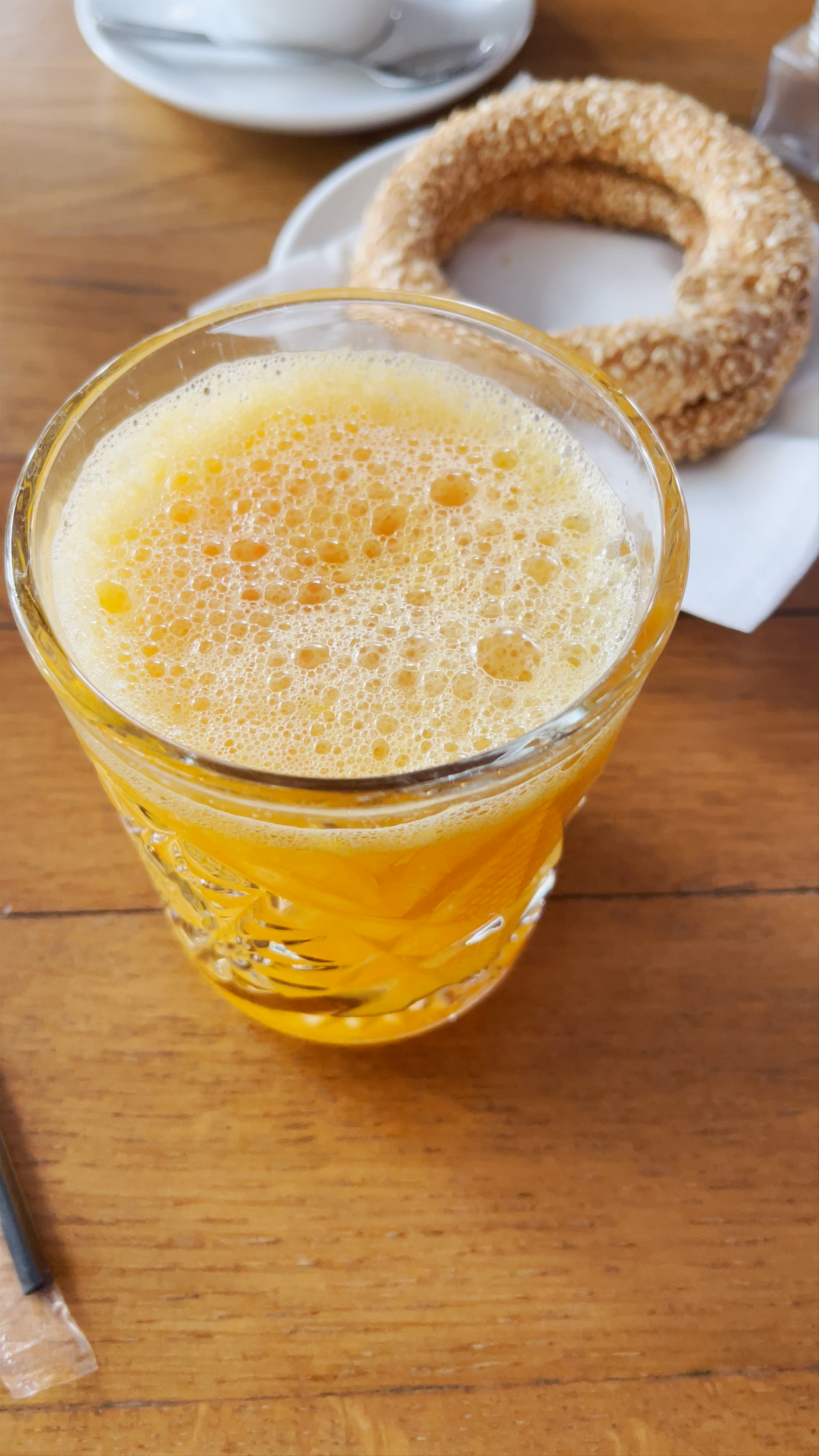 Morning Delights in Peristeri: Fresh Juice and Sesame Koulouri Enjoyed in a Cozy Café