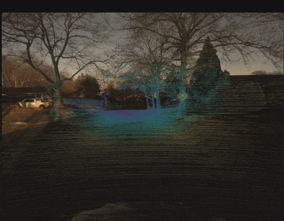 OctoSense forward-facing driving frame with 64-beam LiDAR depth rendered as a teal and blue heatmap over the road and houses at dusk.