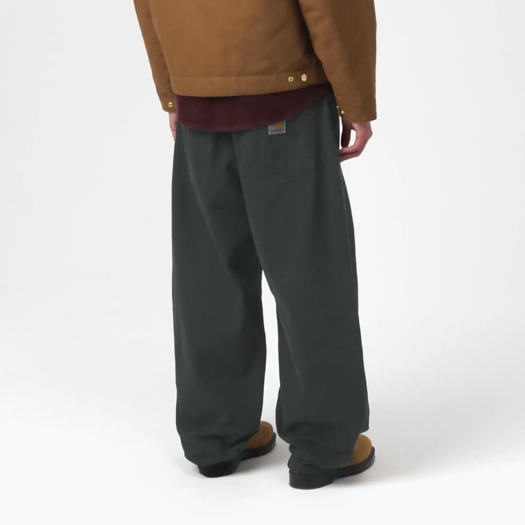 Model wearing a pair of Brandon Pants n Raven Green