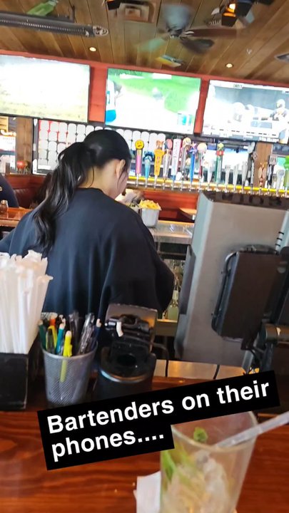 Bubba's 33 - Bartenders on their phone, while people sit empty - American Near Me - Odessa, Texas
