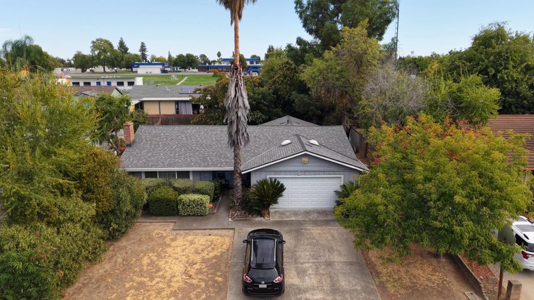 Drone footage of a completed roof replacement in North Highlands, California.