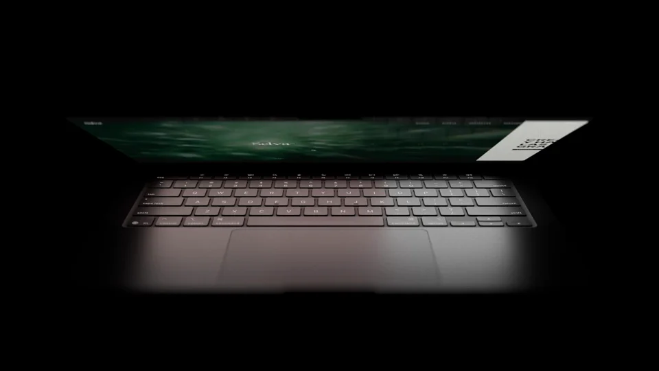 Selva website showcase on a 3D Space Black MacBook Pro displaying the stacked-folder case study portfolio