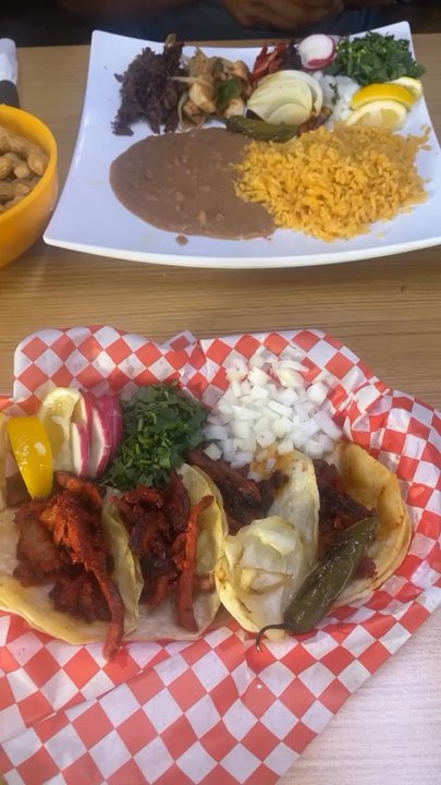 Dos Pueblitos Restaurant - 4 Tacos Corn tortilla and my friend got a plate of trompo, chicken and barbacoa with a side of beans and rice. - Mexican Near Me - Seagoville, Texas