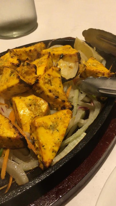 Bombay Grill - Tikka Paneer on a sizzling plate!  Served with Basmati Rice and a creamy, delicious sauce on the side. - Indian Near Me - New City, New York