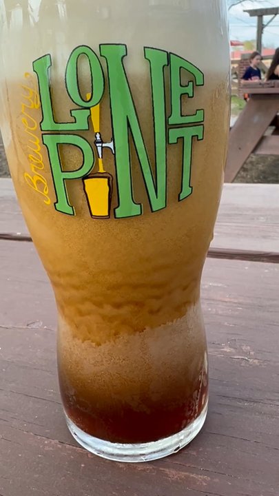 Lone Pint Brewery - The beautiful nitro surge of the Gentleman's Relish - Breweries Near Me - Magnolia, Texas