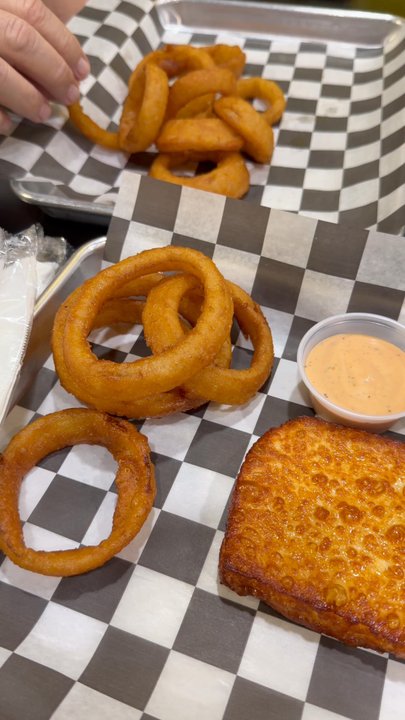 Between Two Buns - My view - onion rings, queso frito, single smash burger and double smash burger - Burgers Near Me - Miami, Florida