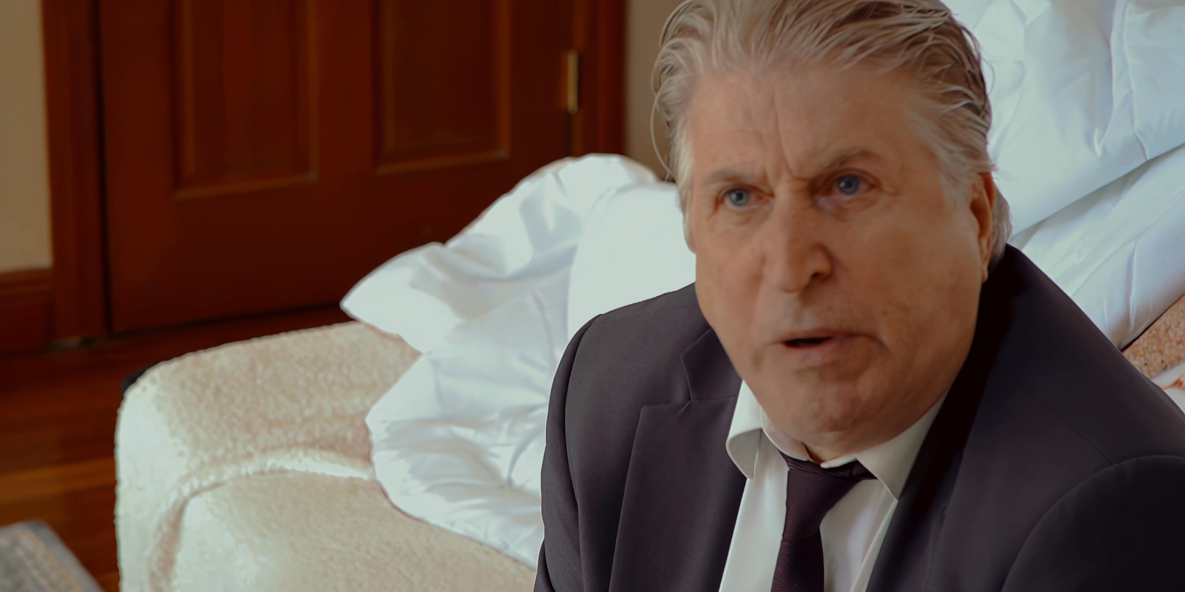 Two men engage in a heated, intense exchange, displaying visible frustration and emotional conflict while positioned in separate interior settings.