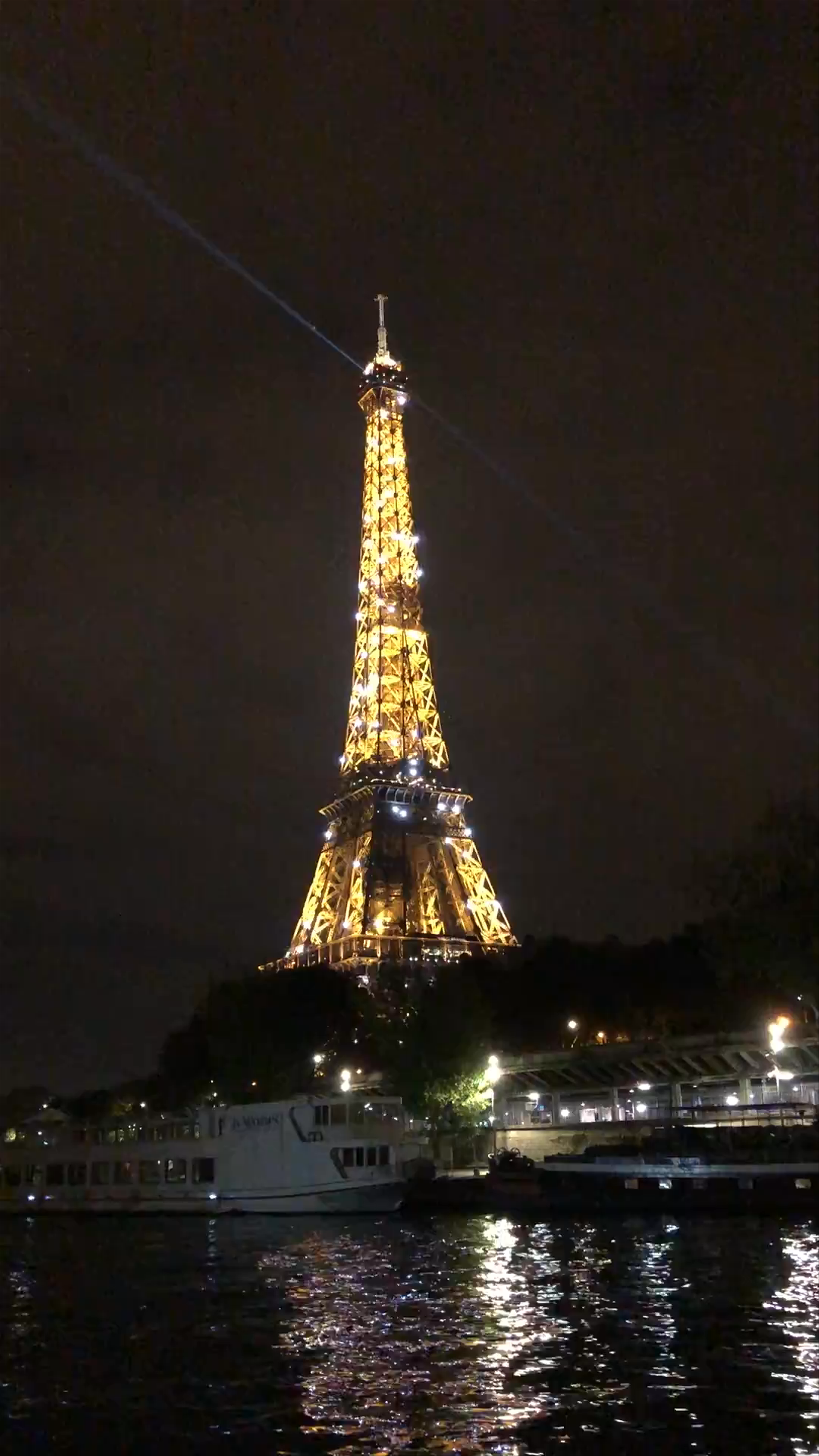Eiffel Tower Illuminated at Night from the Seine River