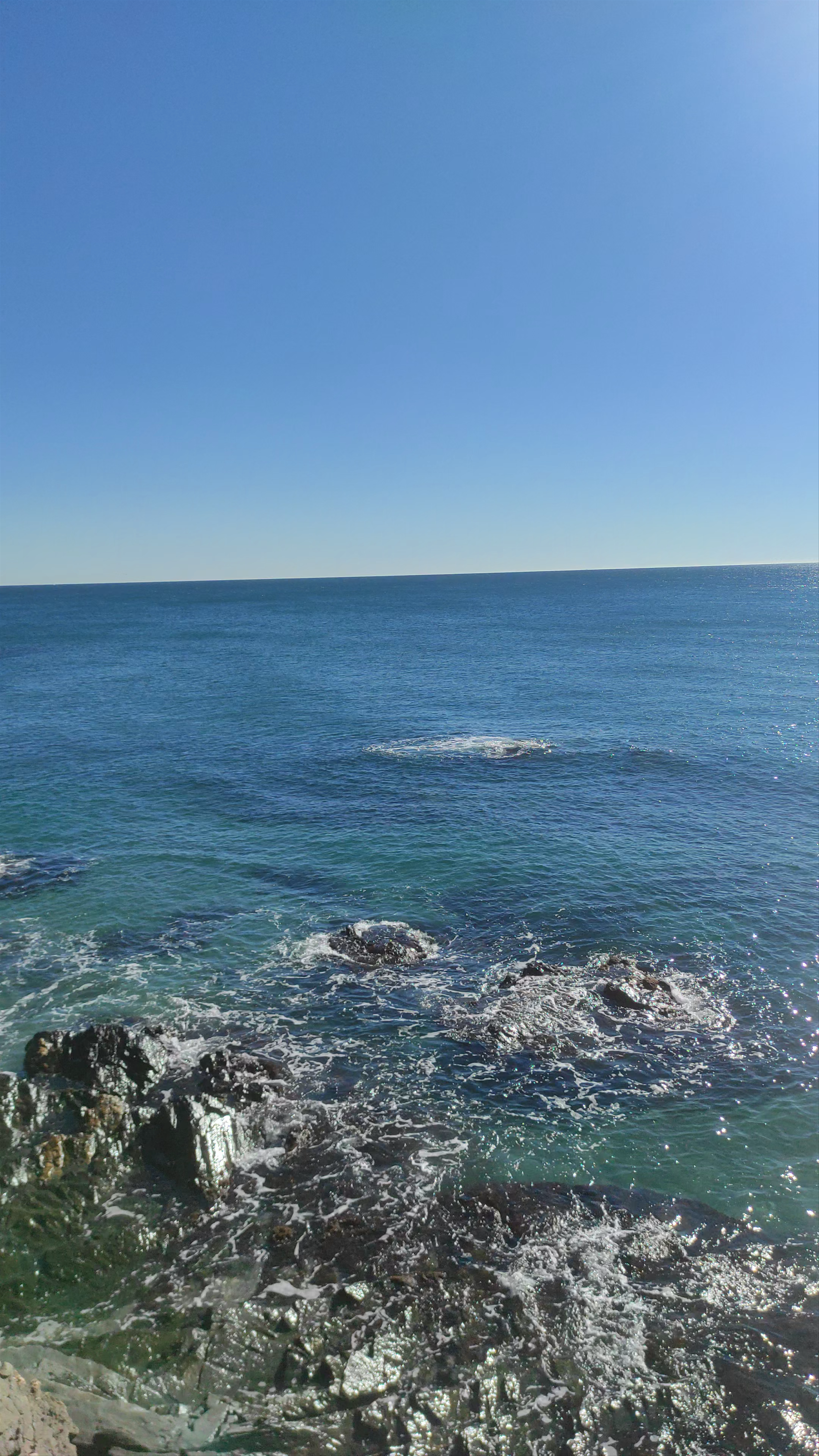 Sunlit Coastal Serenity at Playa Los Tajos, Las Lagunas, Spain