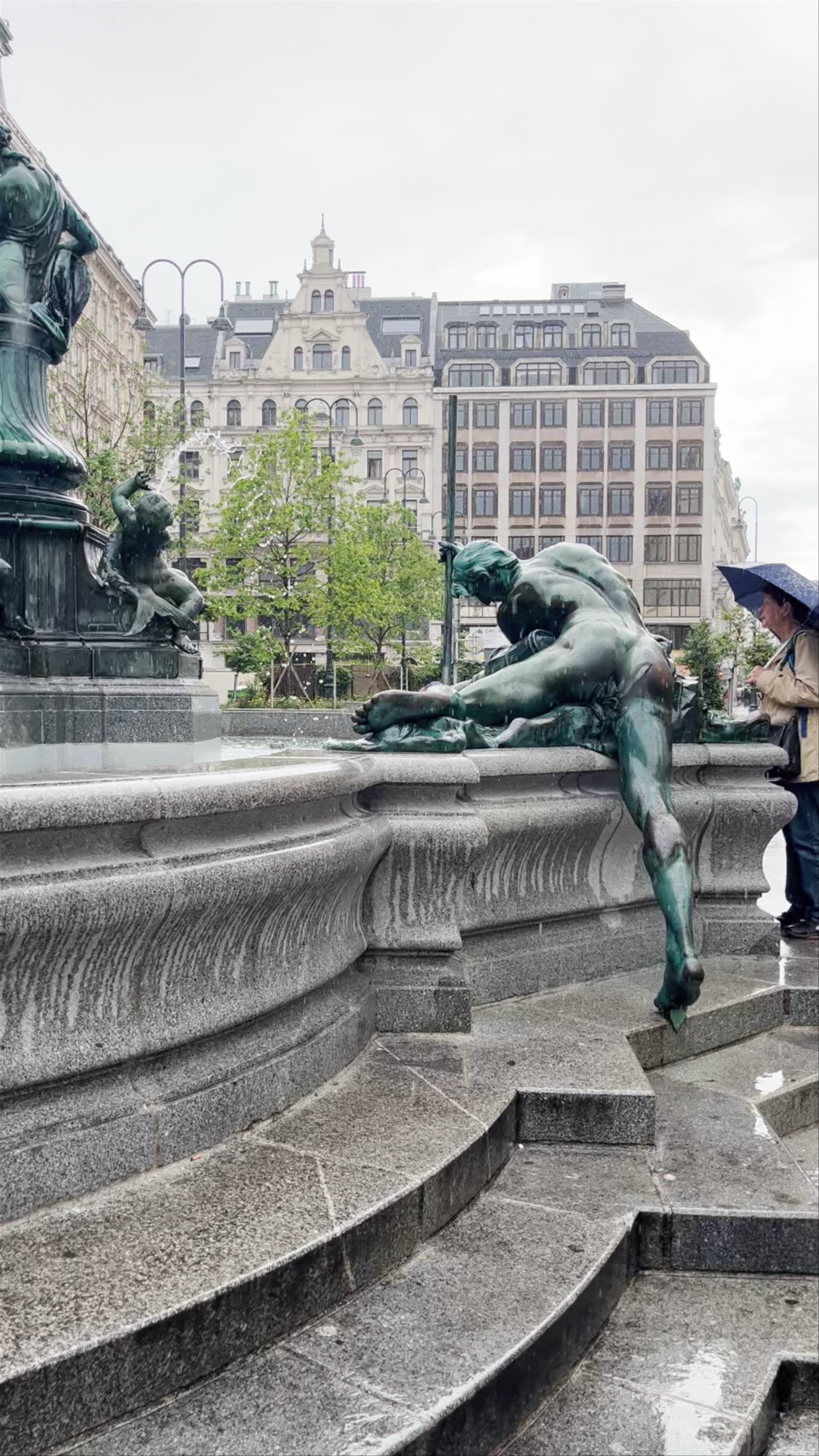 Donnerbrunnen Fountain at Neuer Markt, Vienna - A Rain-Kissed Urban Classic