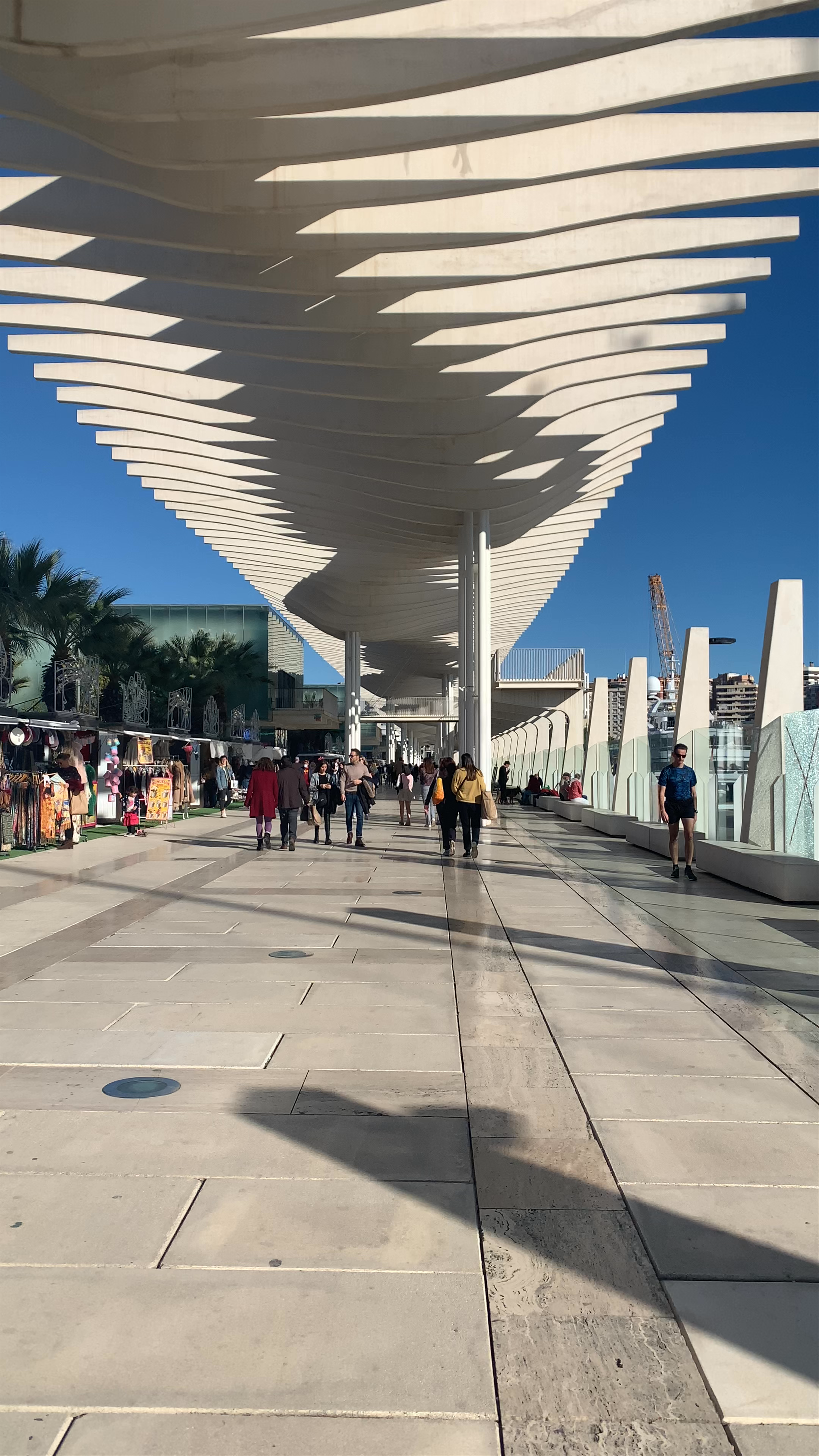 Paseo del Muelle Uno: Sunny Stroll at Málaga's Waterfront Market