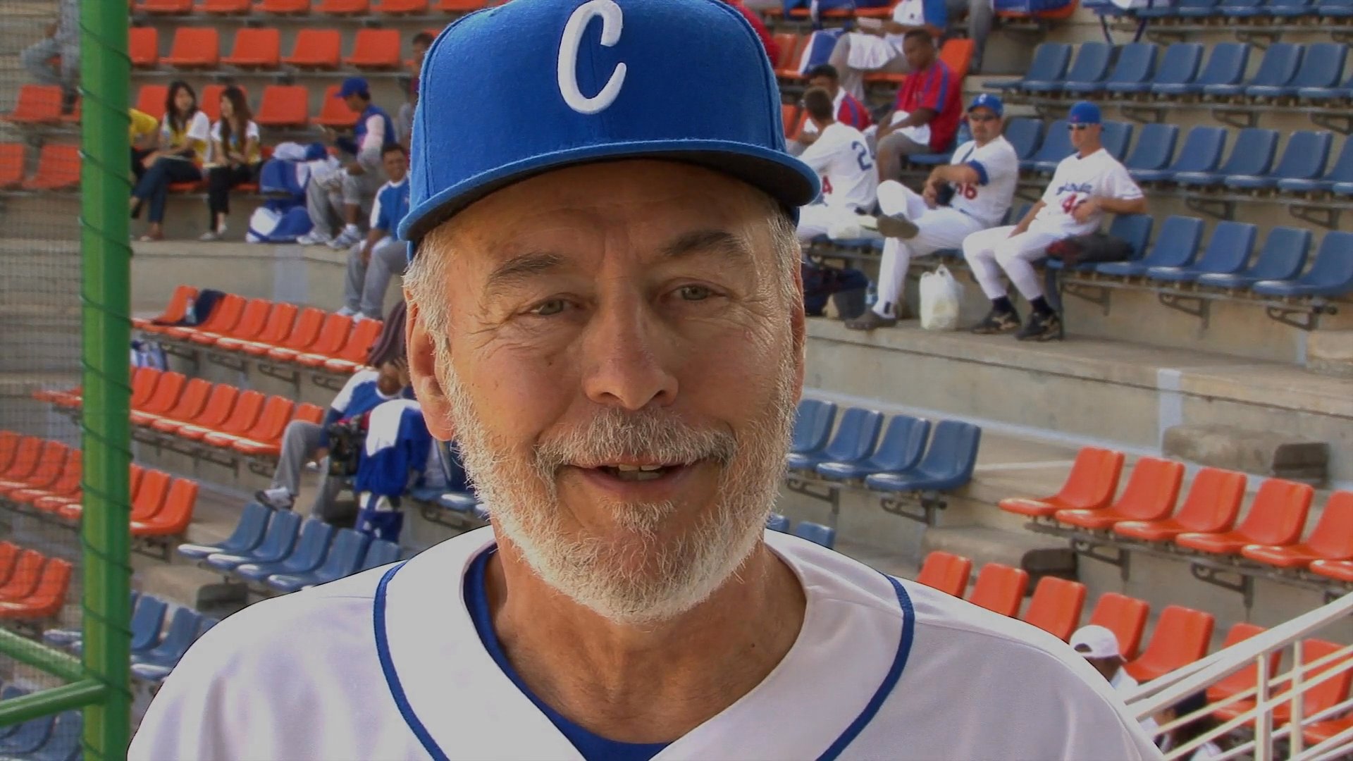 A baseball player discusses the team's commitment to giving their best effort, followed by insights from coaching staff at an outdoor stadium.