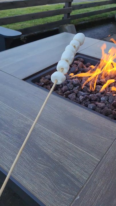 The Maverick Hotel - Roasting marshmallows on the patio - Hotels Near Me - Eugene, Oregon