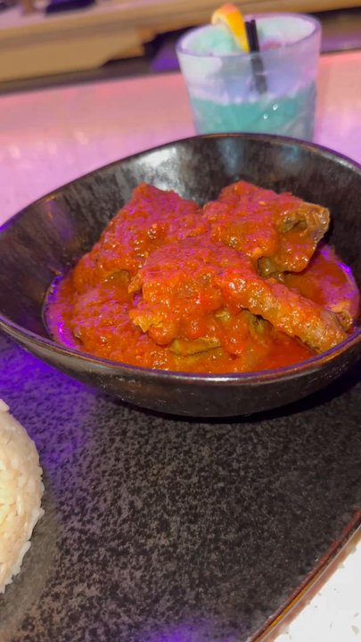 Native - Chicken stew, with jollof and white rice! I had one of their frozen drinks super good and strong. - Lounges Near Me - Brooklyn, New York