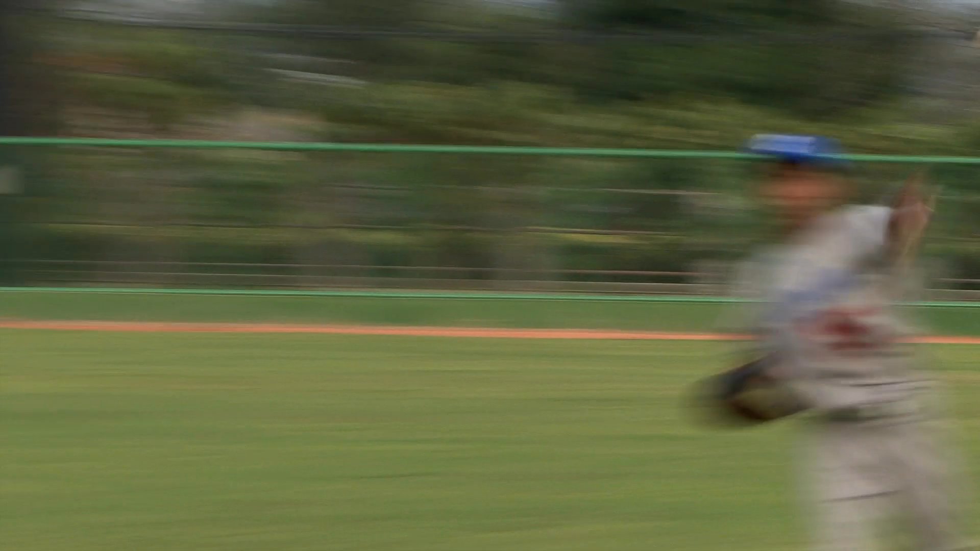 Members of a baseball team engage in various practice drills, including batting, fielding, and base running, on an outdoor diamond.