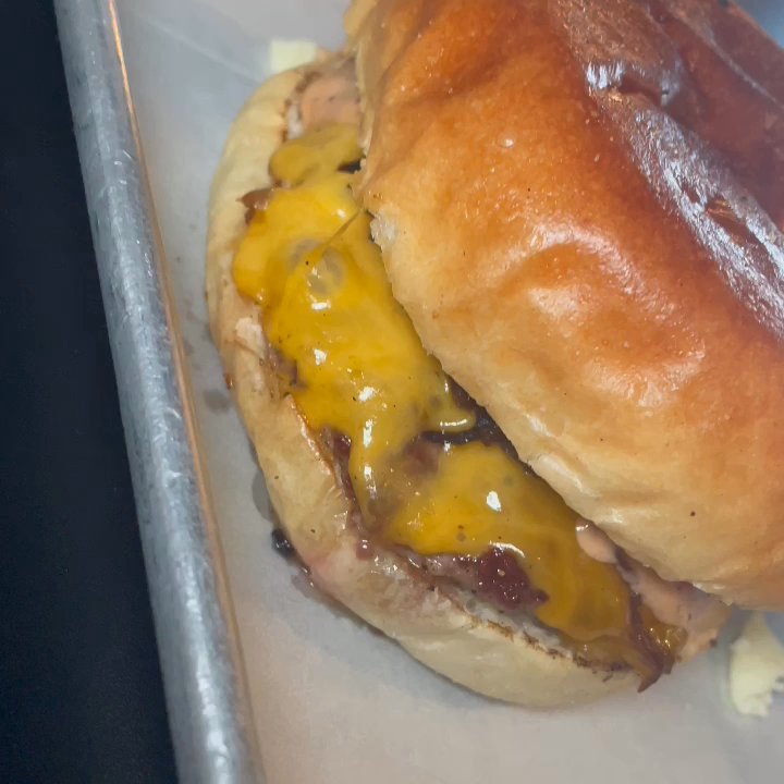 Smoqehouse - Brisket burger with smoked cheddar, caramelizad onions & smoq'n sauce with poutine fries (cheese curds & gravy) - Barbeque Near Me - Bradenton Beach, Florida