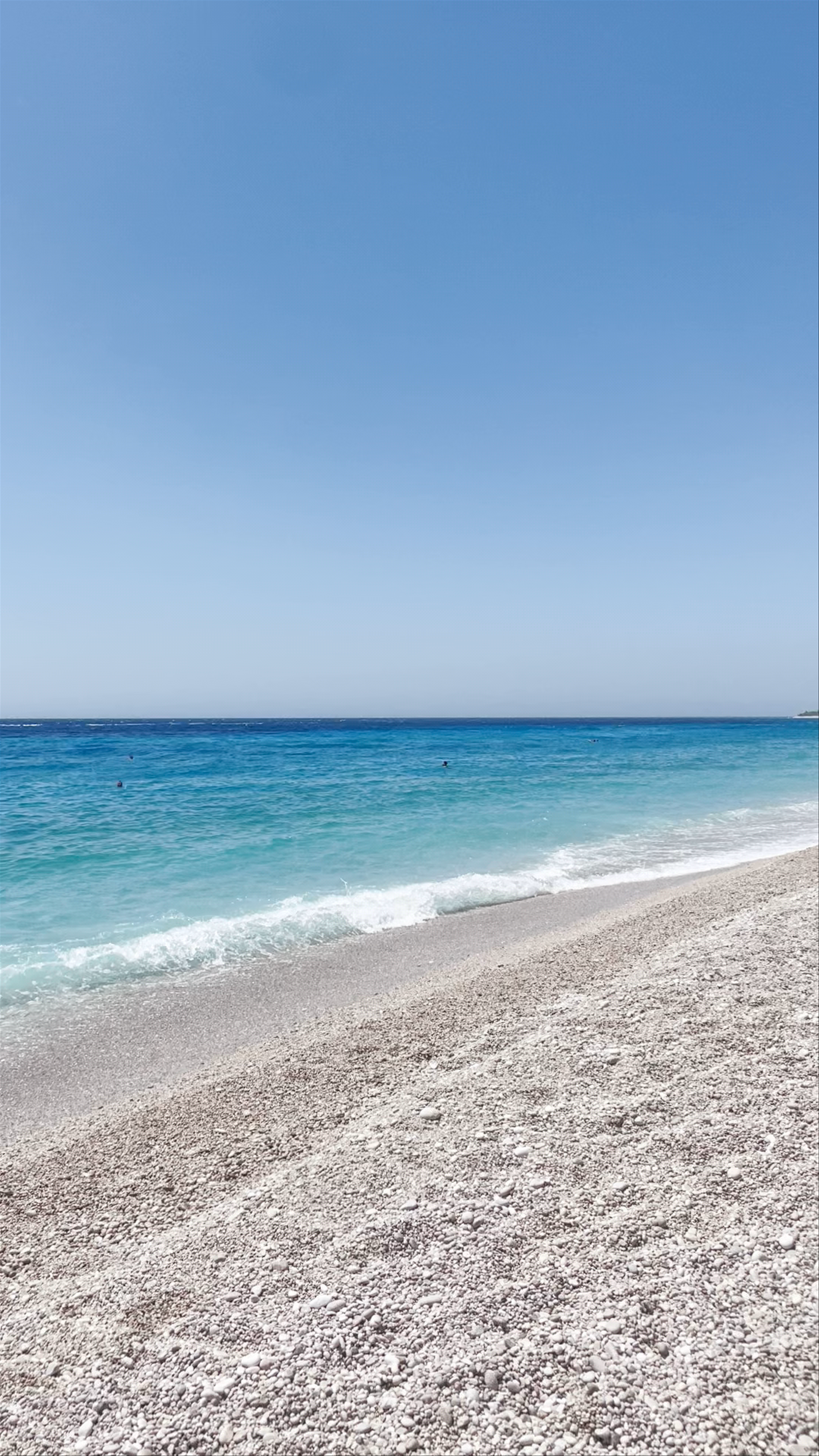 Drymades Beach: Serene Coastline and Relaxing Sunbathing in Dhërmi, Albania