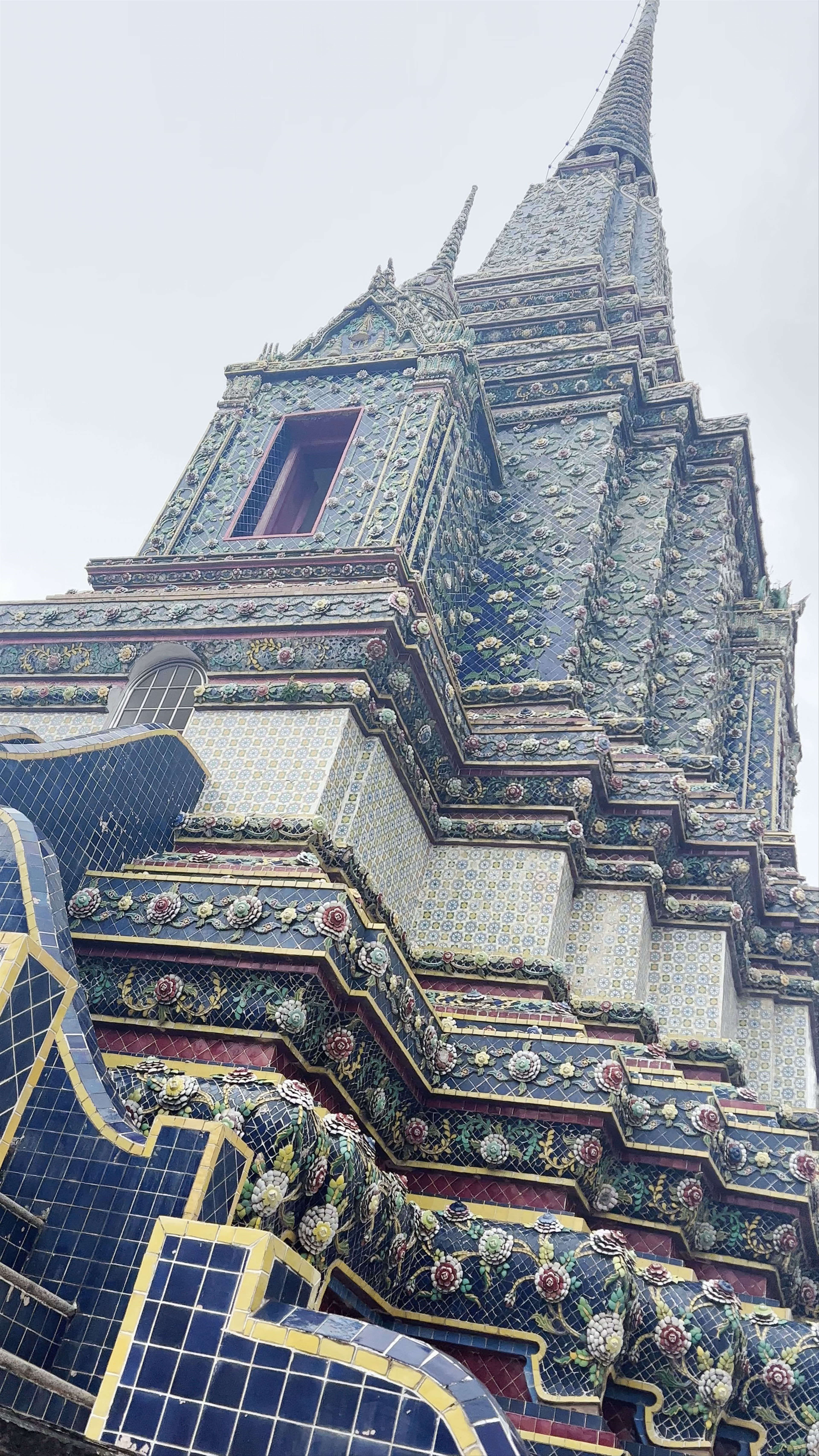 The Reclining Buddha and Wat Pho’s Ornate Stupas in Bangkok