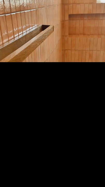 Refined Tile Solutions - Cordless entry, shower, with flat pebbles on shower floor,, custom build vanity tile, 2 x 8 porcelain and shower walls and wainscoting - Flooring Near Me