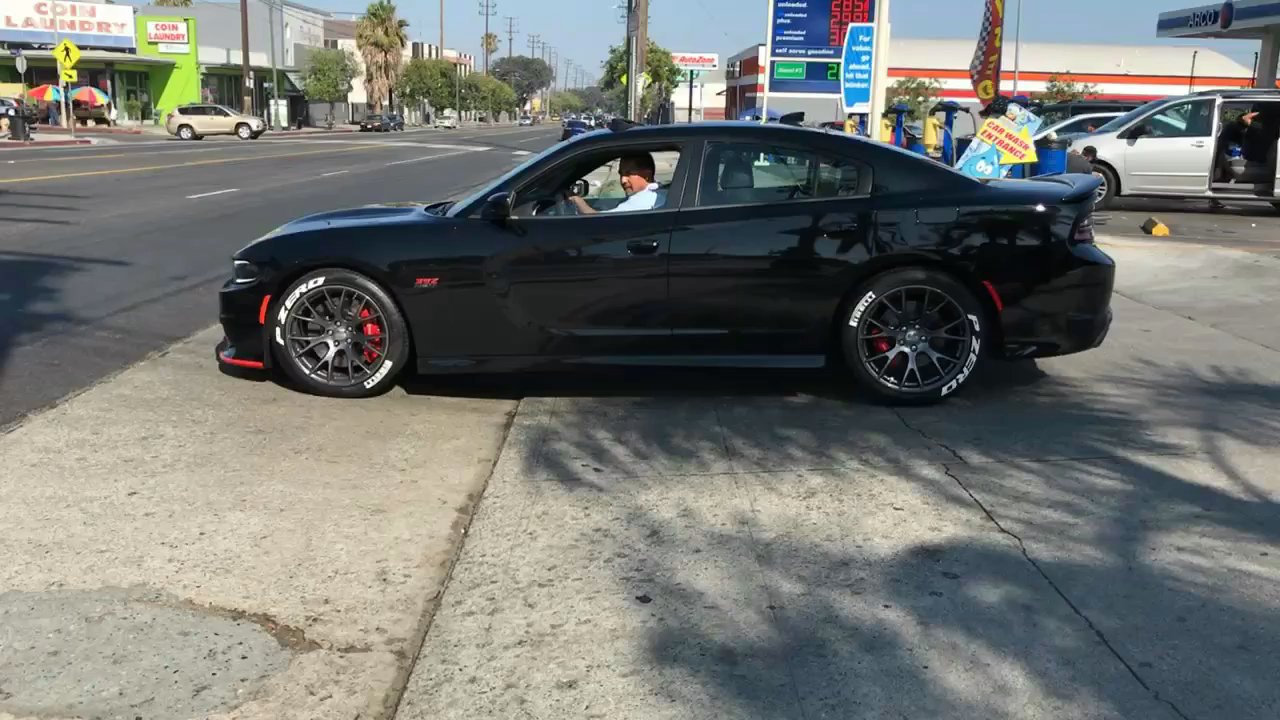Premium Auto Connection - Happy customer driving away with its tire lettering kit installed - Car Window Tinting Near Me - Los Angeles, California