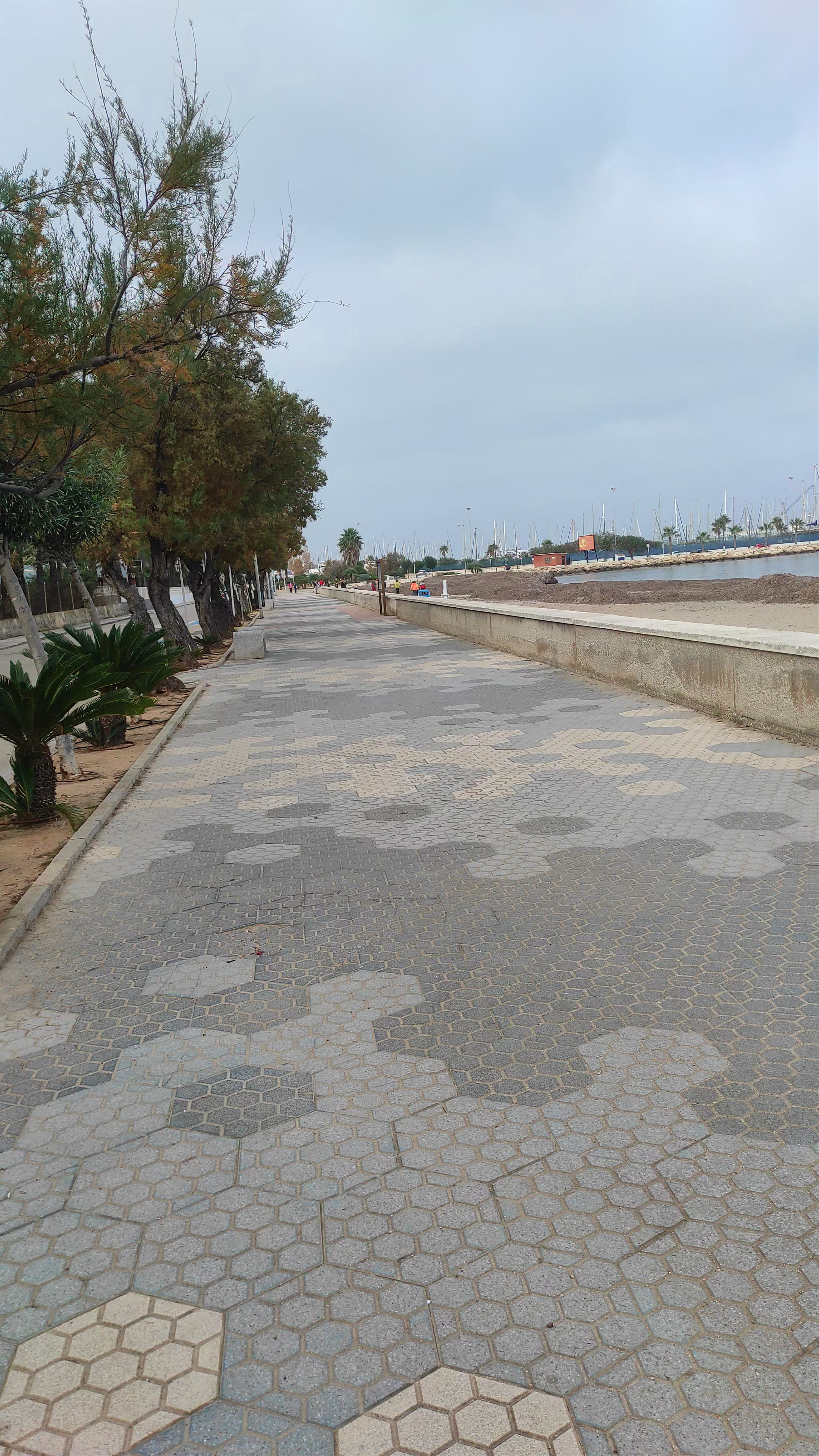 Serene Stroll Along Playa de la Marineta Casiana, Spain