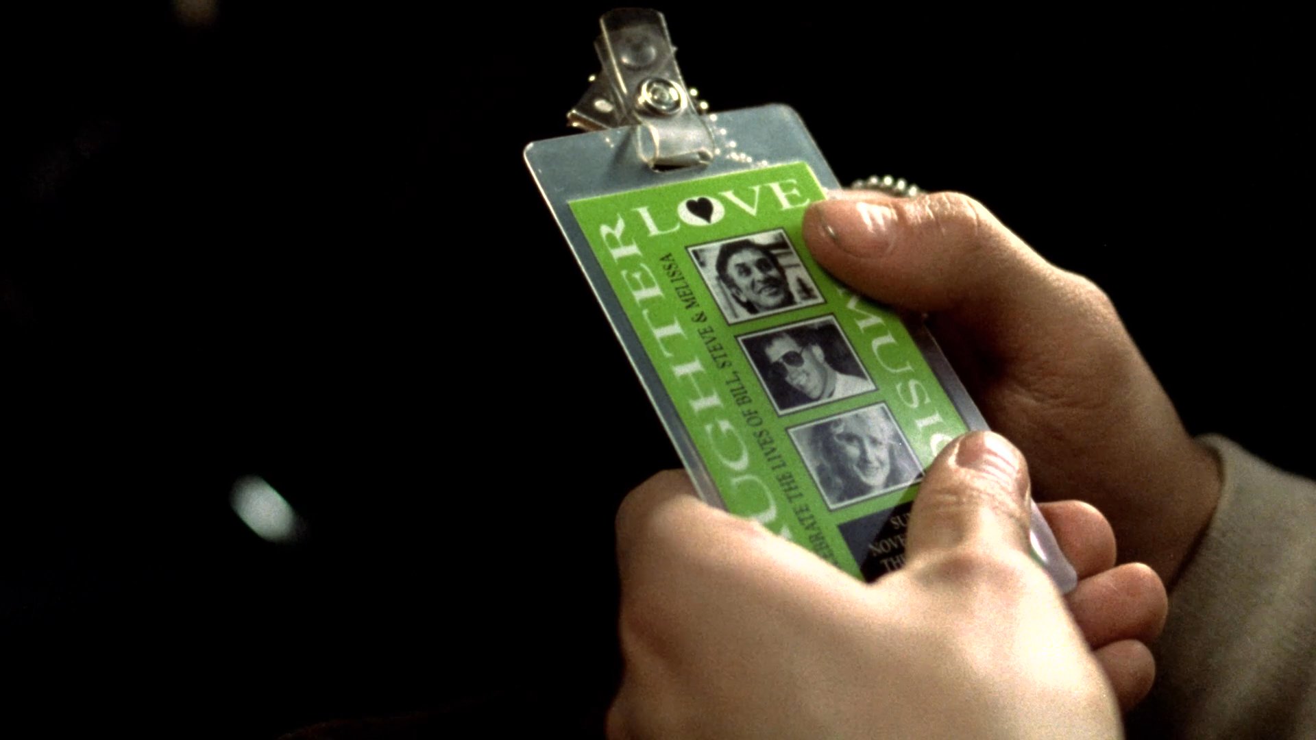 A man experiences somber memories of personal connections while holding a photo ID, which transitions into a stylized animation of a helicopter crashing in a storm. The sequence highlights themes of emotional detachment and sudden catastrophic loss.