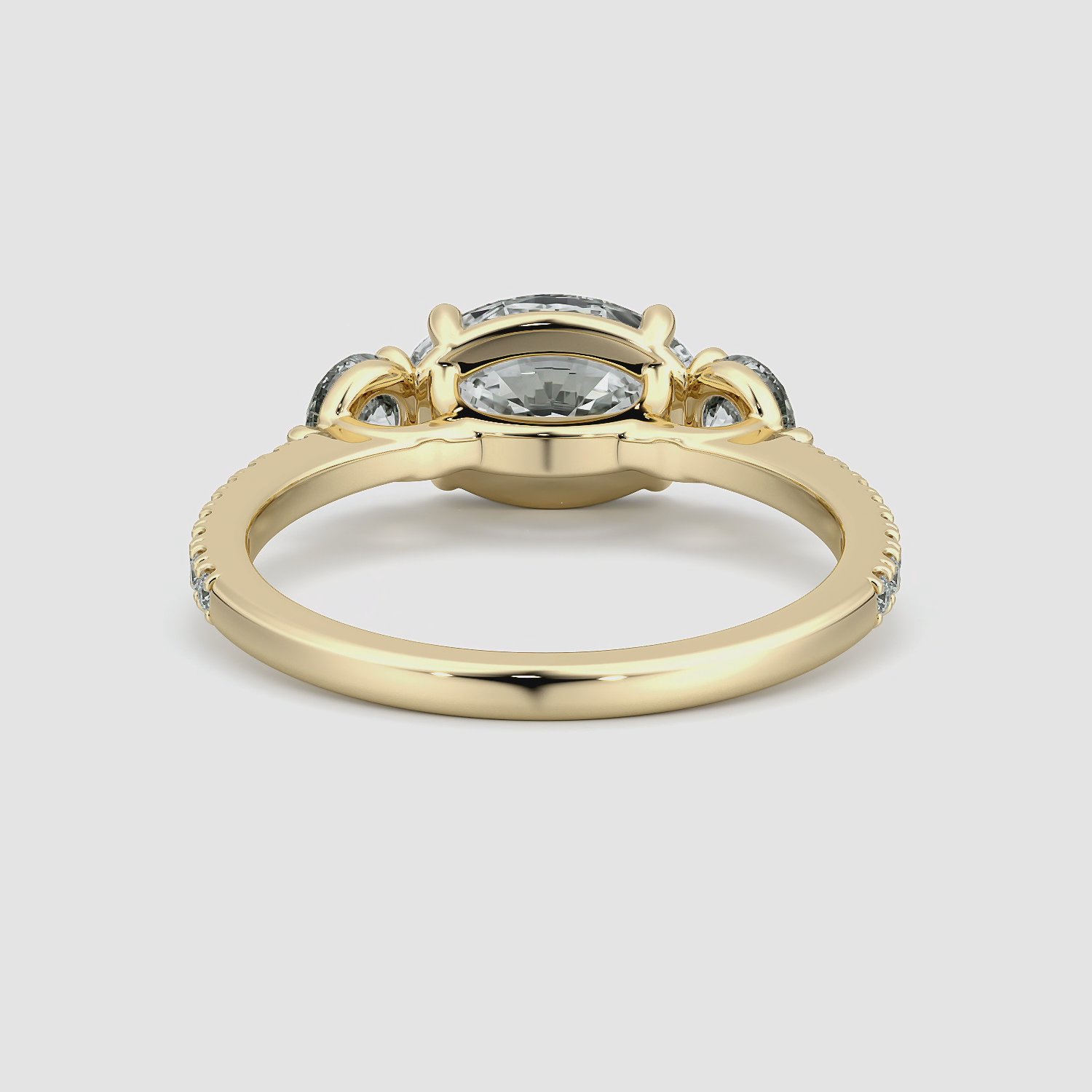 The Three Stone | Oval | 18k | Yellow Gold | bandAccent: Pavé | diamondOrientation: horizontal | sideStoneCarat: 0.25ct | sideStoneShape: Round Brilliant | caratWeight: other