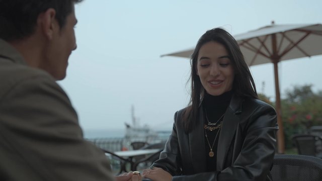 A loving couple sitting in a café on Valentine's Day