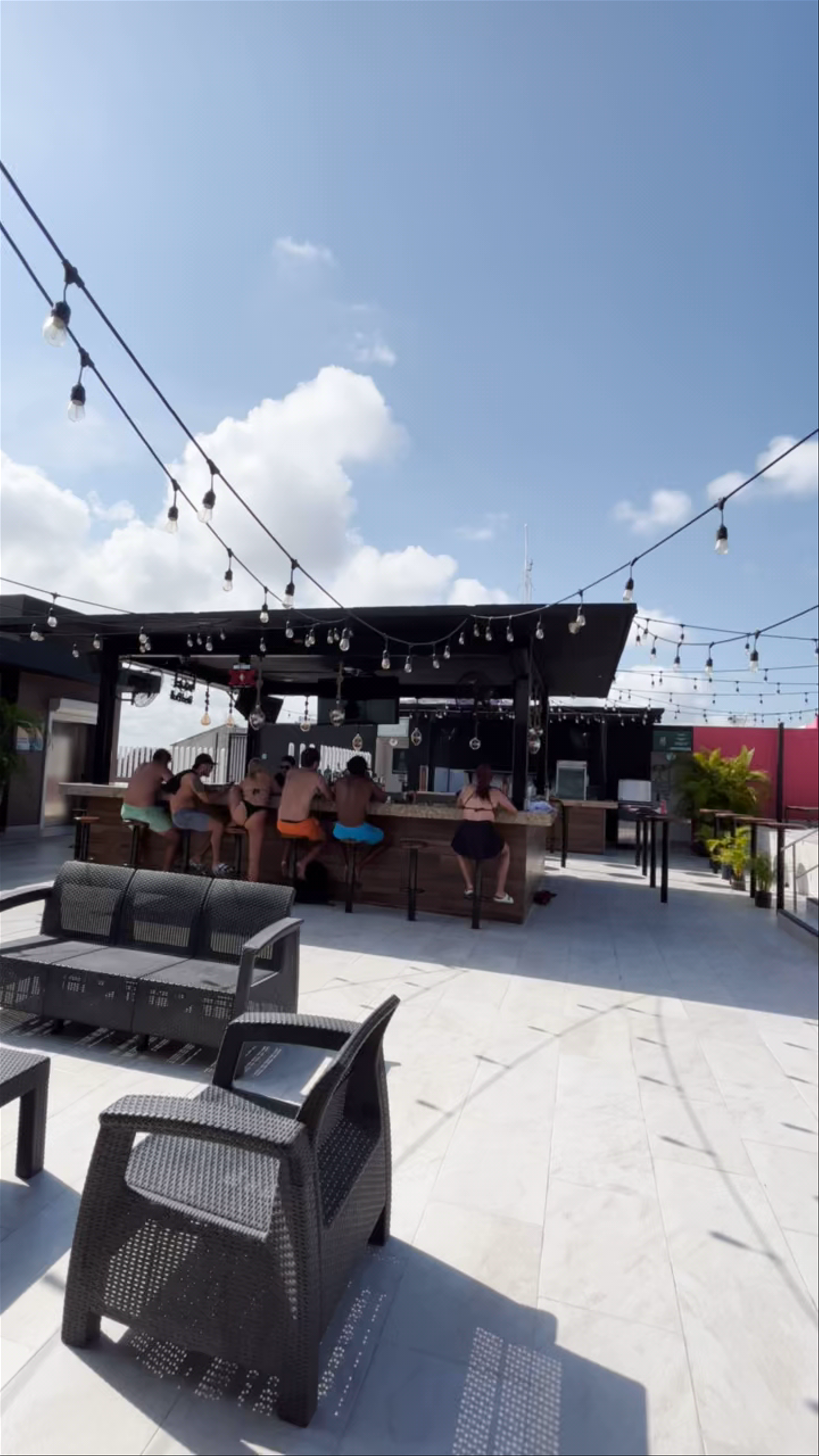 Vibrant Rooftop Pool Party at Nomads Party Hostel in Cancún