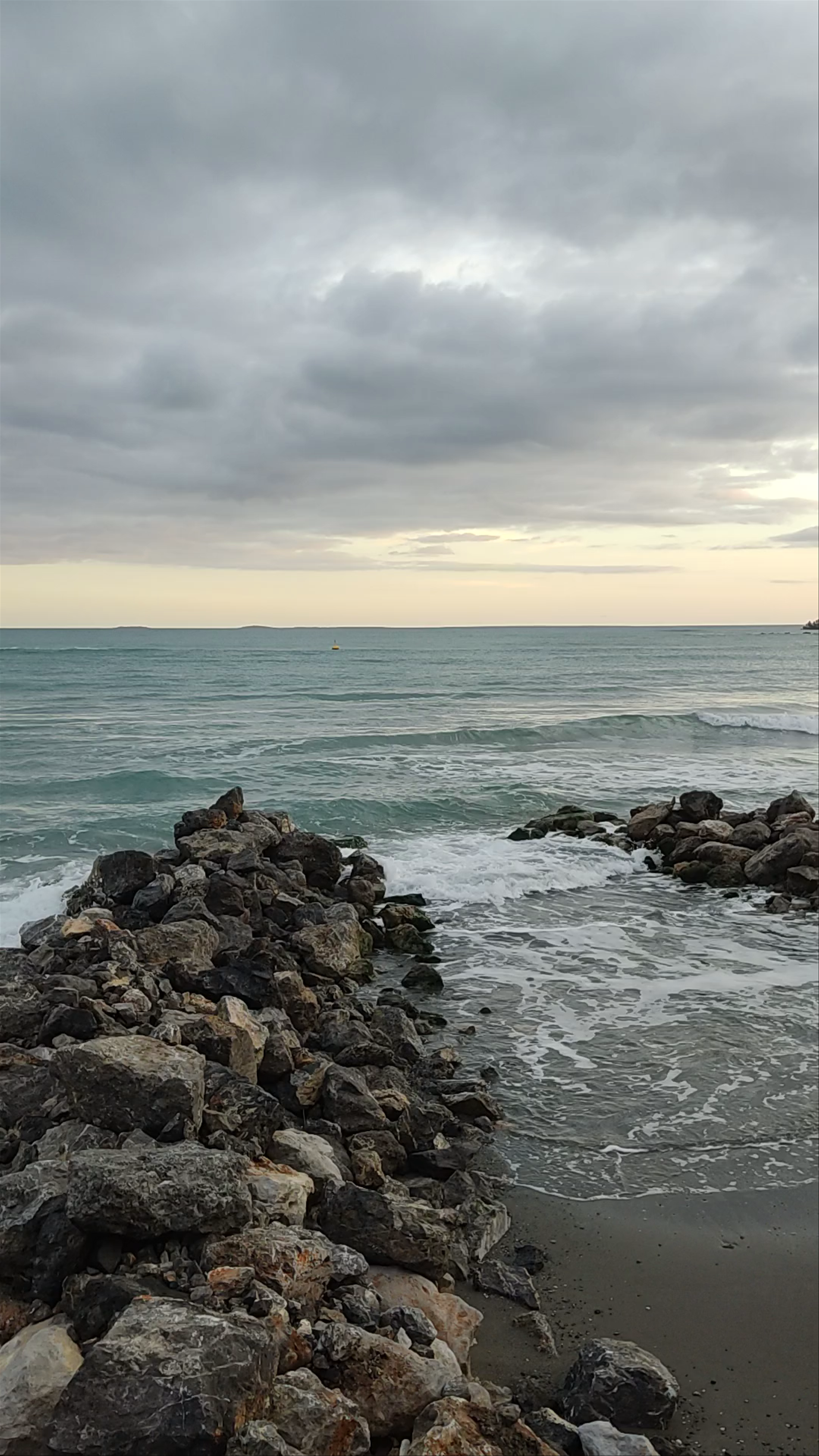 Serene Coastal Sunset at Paralia Agiou Andrea, Greece