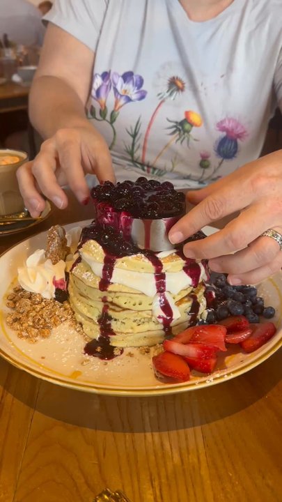 Bistrology - The Pancakes Berry Melt--enough to feed a family of 4. Plentiful fresh fruit atop a mountainous stack of hot flapjacks. Healthy breakfast? - Breakfast & Brunch Near Me - Miramar Beach, Florida