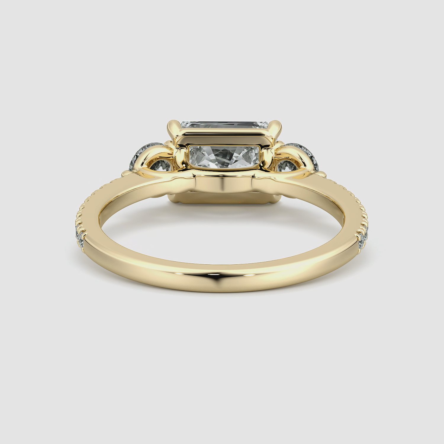 The Three Stone | Radiant | 18k | Yellow Gold | bandAccent: Pavé | diamondOrientation: horizontal | sideStoneCarat: 0.25ct | sideStoneShape: Round Brilliant | caratWeight: other