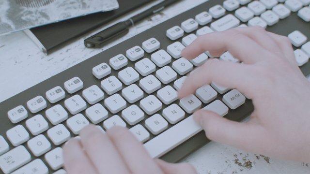 Typing on a white keyboard