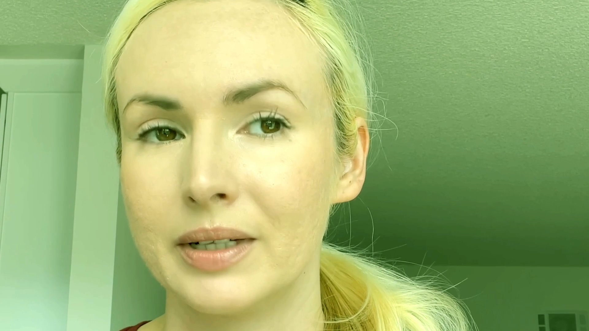 A blonde woman presents skincare advice directly to the camera, sharing beauty tips and personal insights.