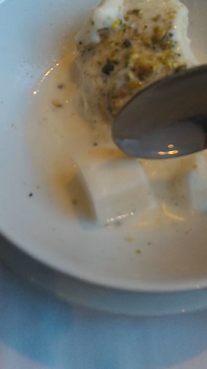 Restaurant Alep - Close-up of the gelified milk pudding.  Jiggly! - Middle Eastern Near Me - Montreal, Quebec