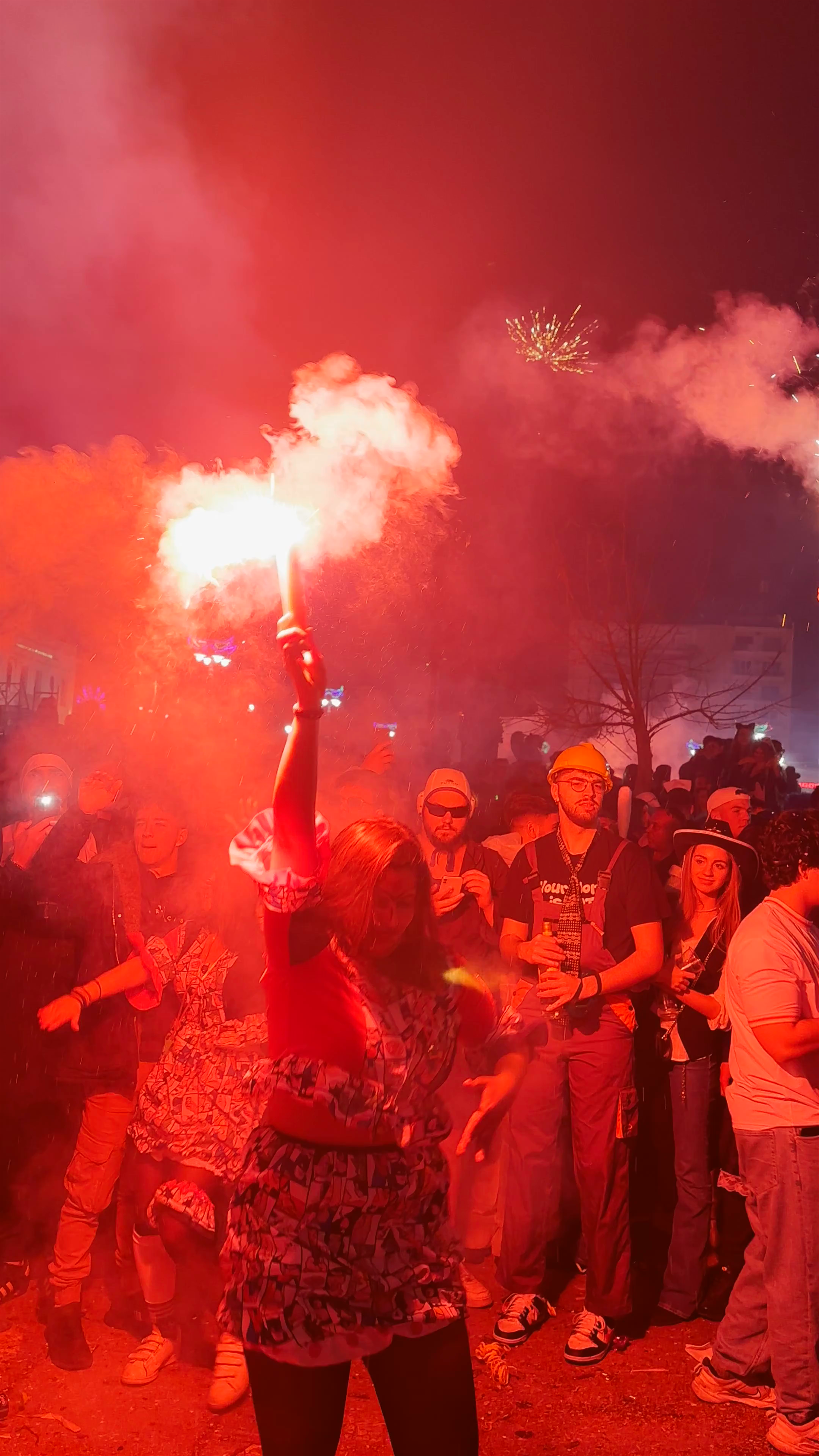 Vibrant Night Celebration with Flares in Patras, Greece