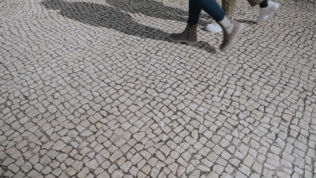 Cobblestone pavement with people walking