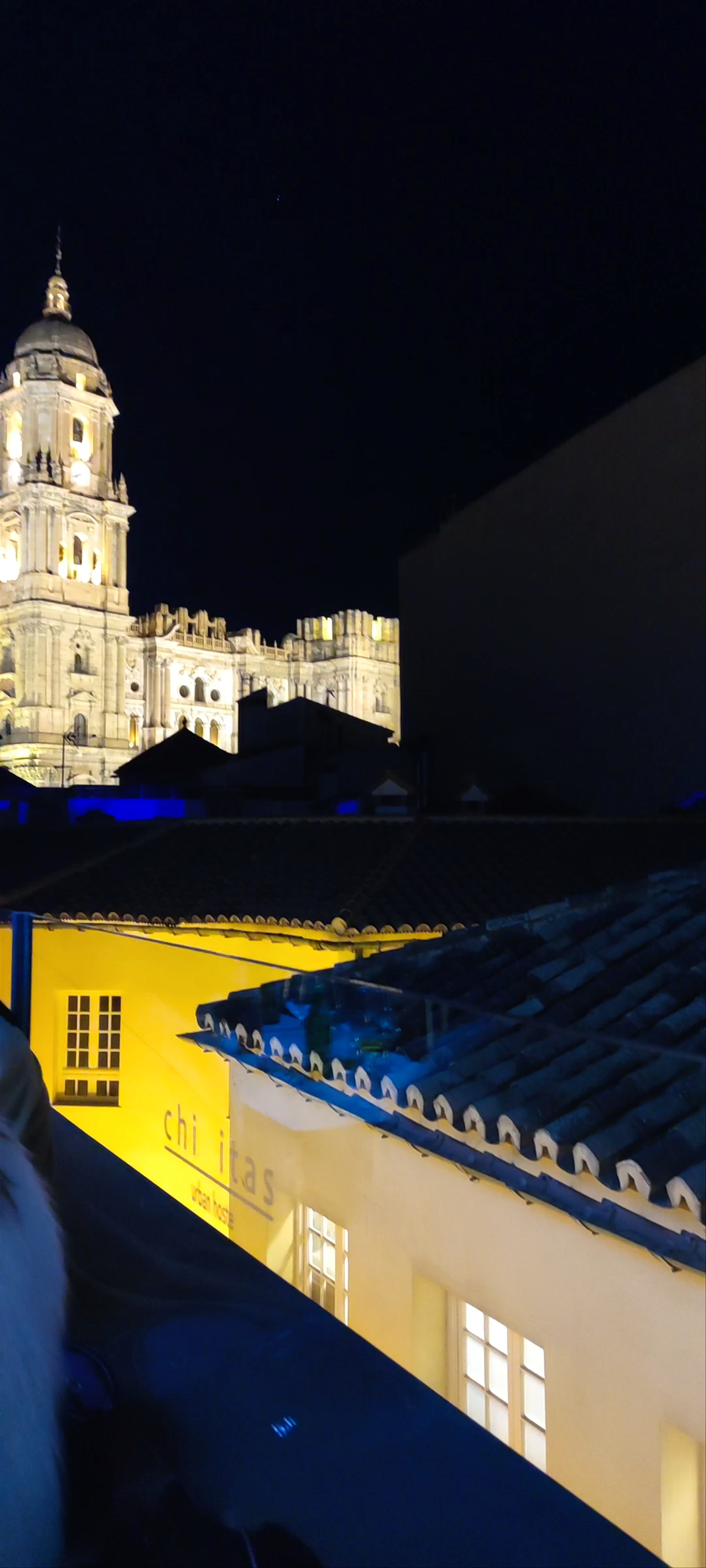Nighttime Magic at Chinitas Urban Hostel with Views of Málaga Cathedral