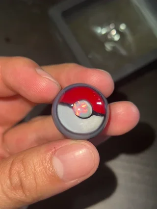 Preview pic of Di$qo glass pokeball/encalmo marble with opal coin.