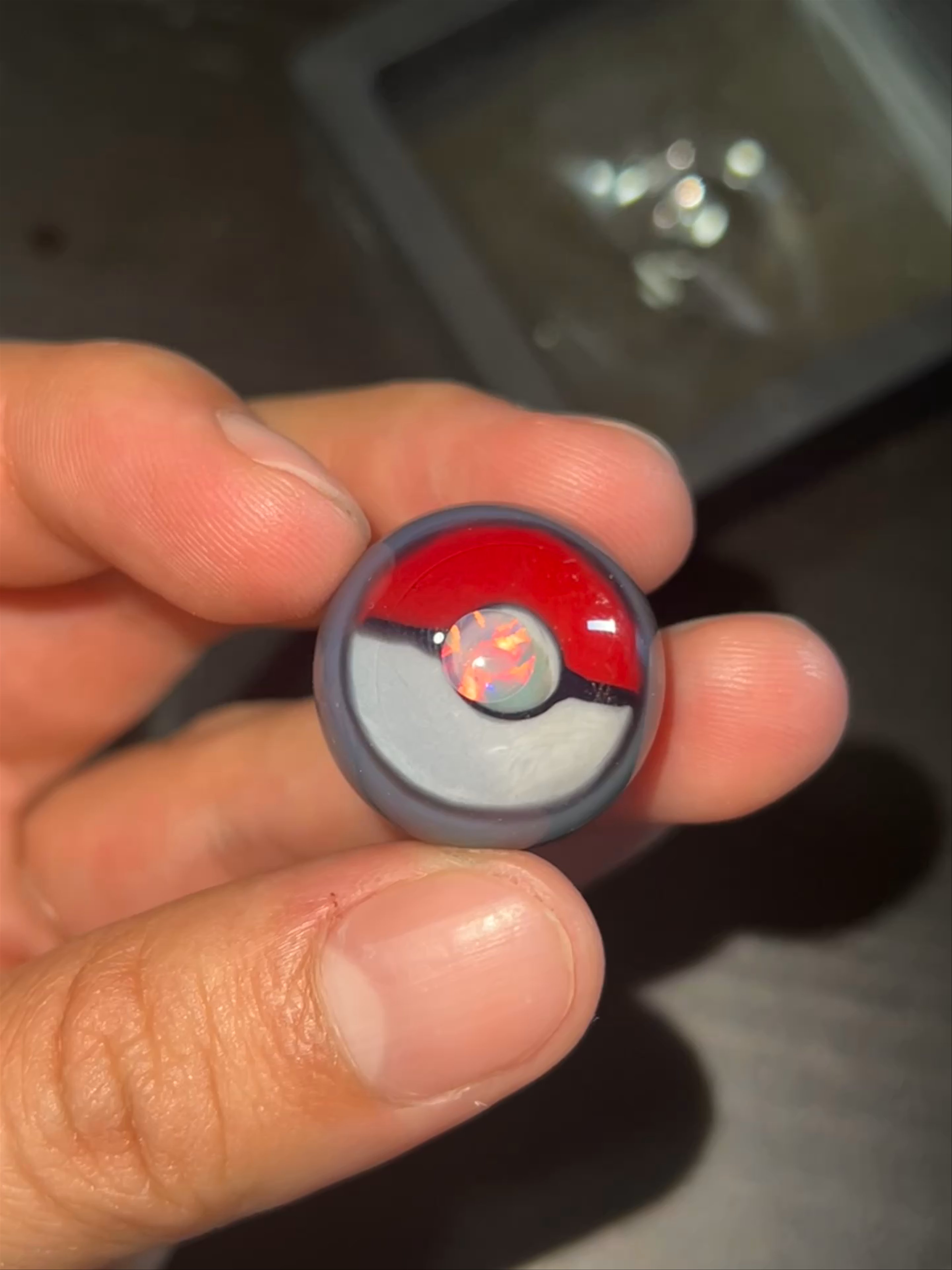 Preview pic of Di$qo glass pokeball/encalmo marble with opal coin.